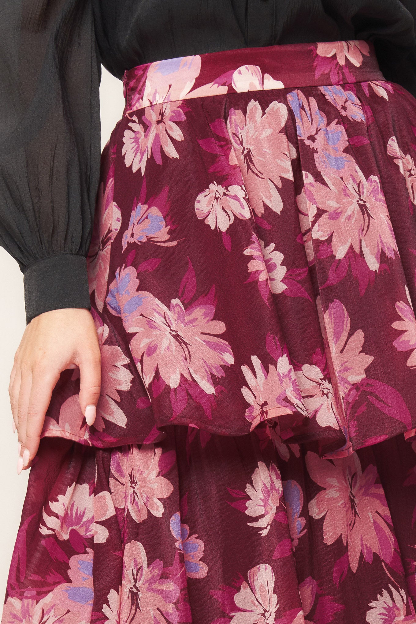 A printed woven maxi skirt with layers and side zipper closure. 