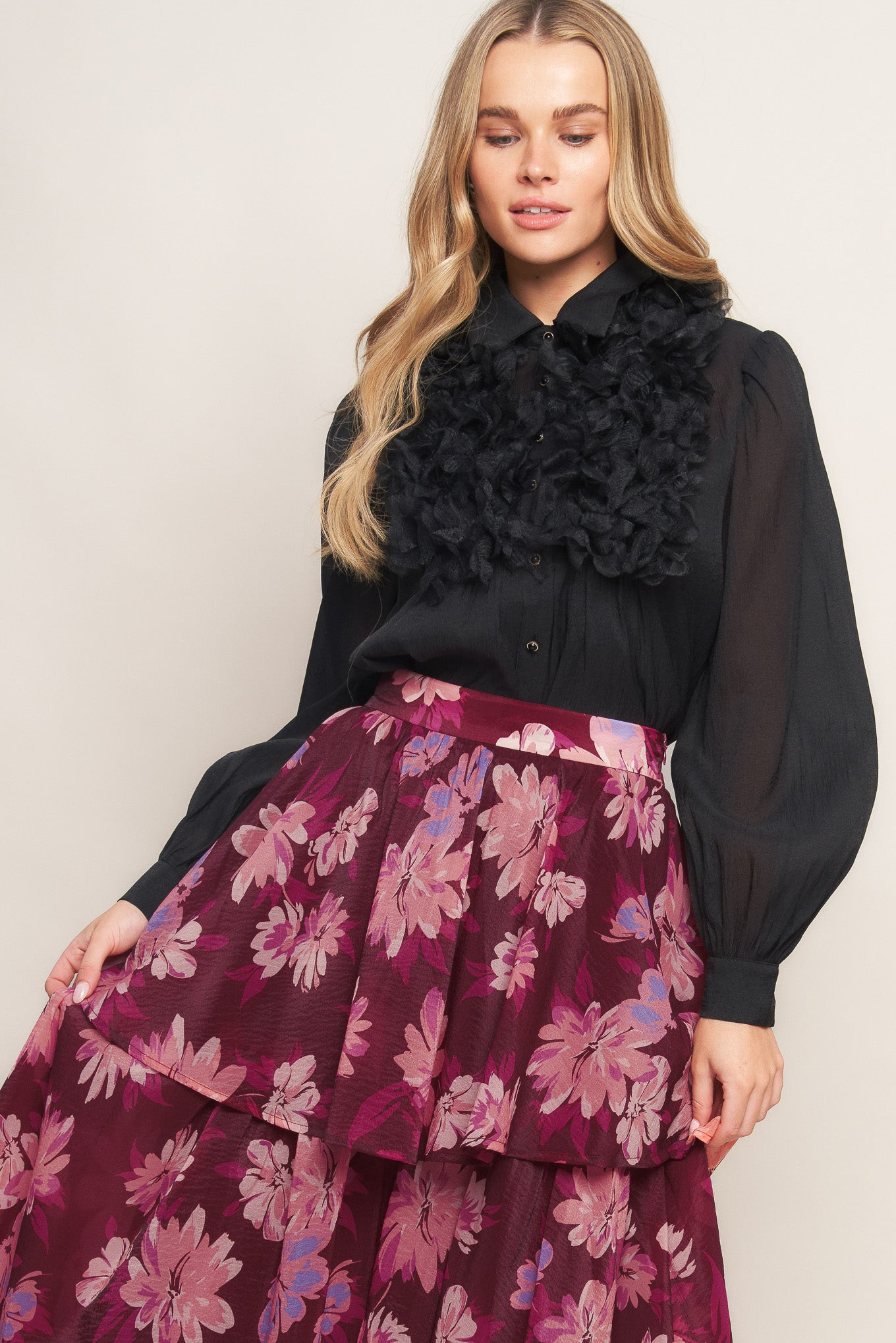 A printed woven maxi skirt with layers and side zipper closure. 