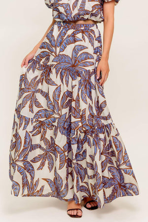 A printed woven maxi skirt featuring elasticized waist and tiers.