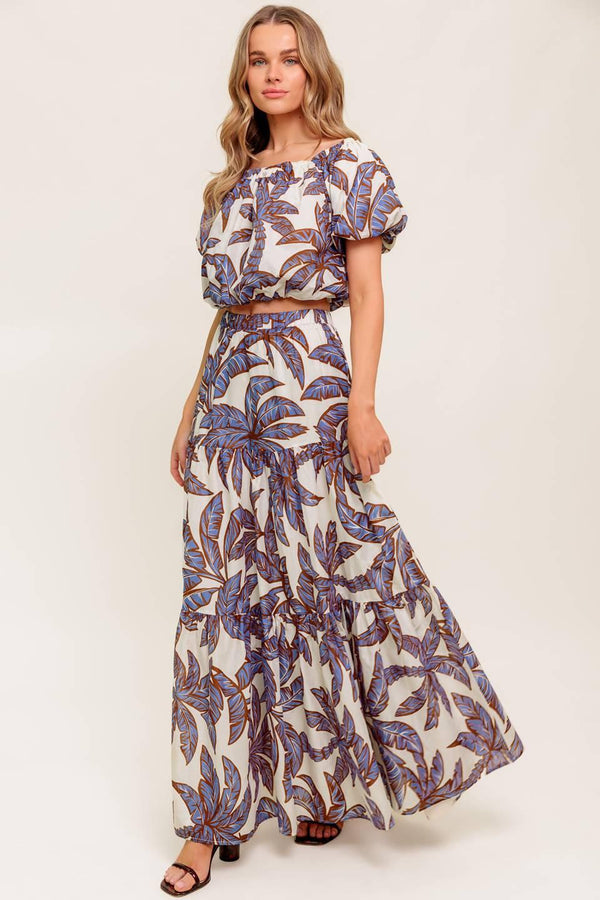 A printed woven maxi skirt featuring elasticized waist and tiers.