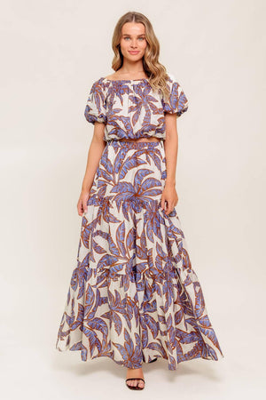 A printed woven maxi skirt featuring elasticized waist and tiers.