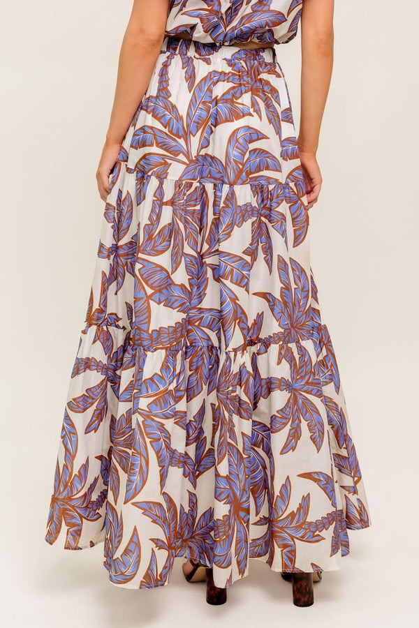 A printed woven maxi skirt featuring elasticized waist and tiers.