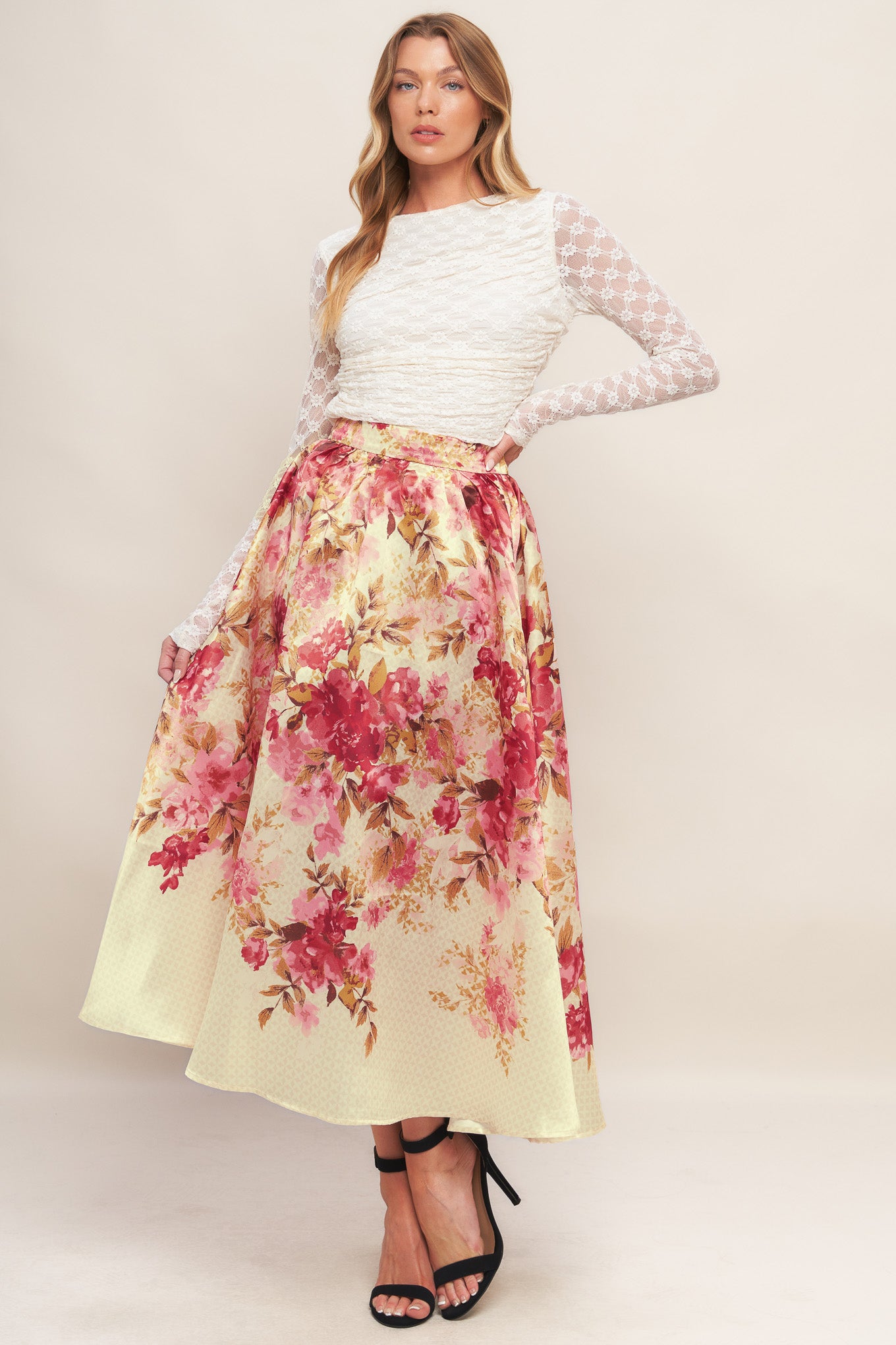 A printed woven full midi skirt with back zipper closure.