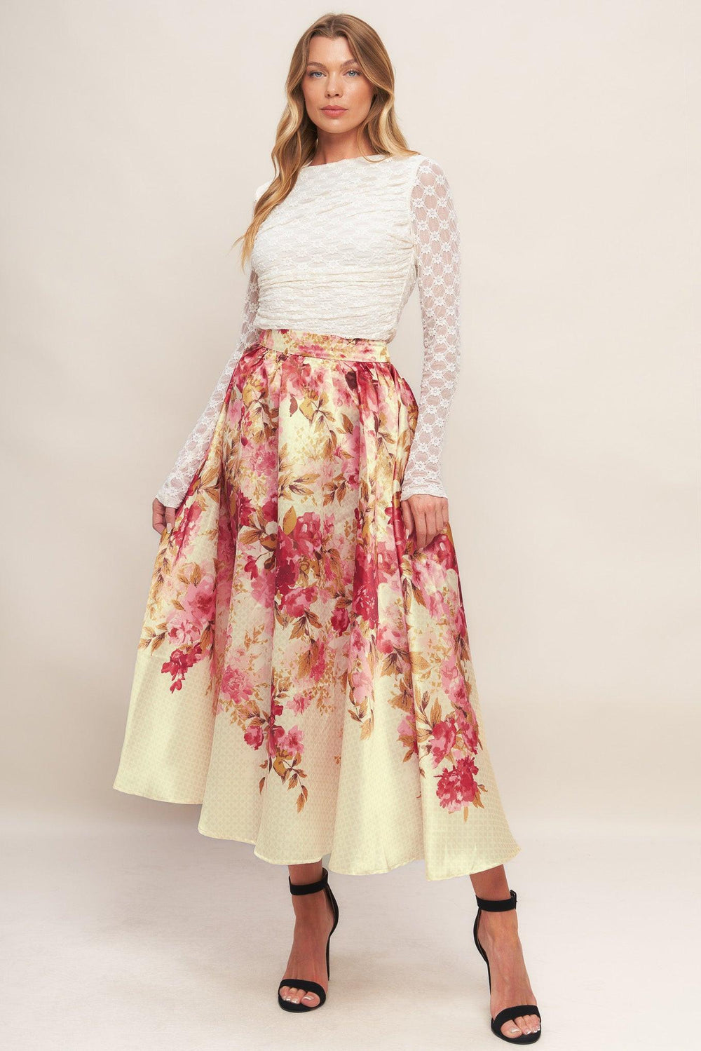 A printed woven full midi skirt with back zipper closure.