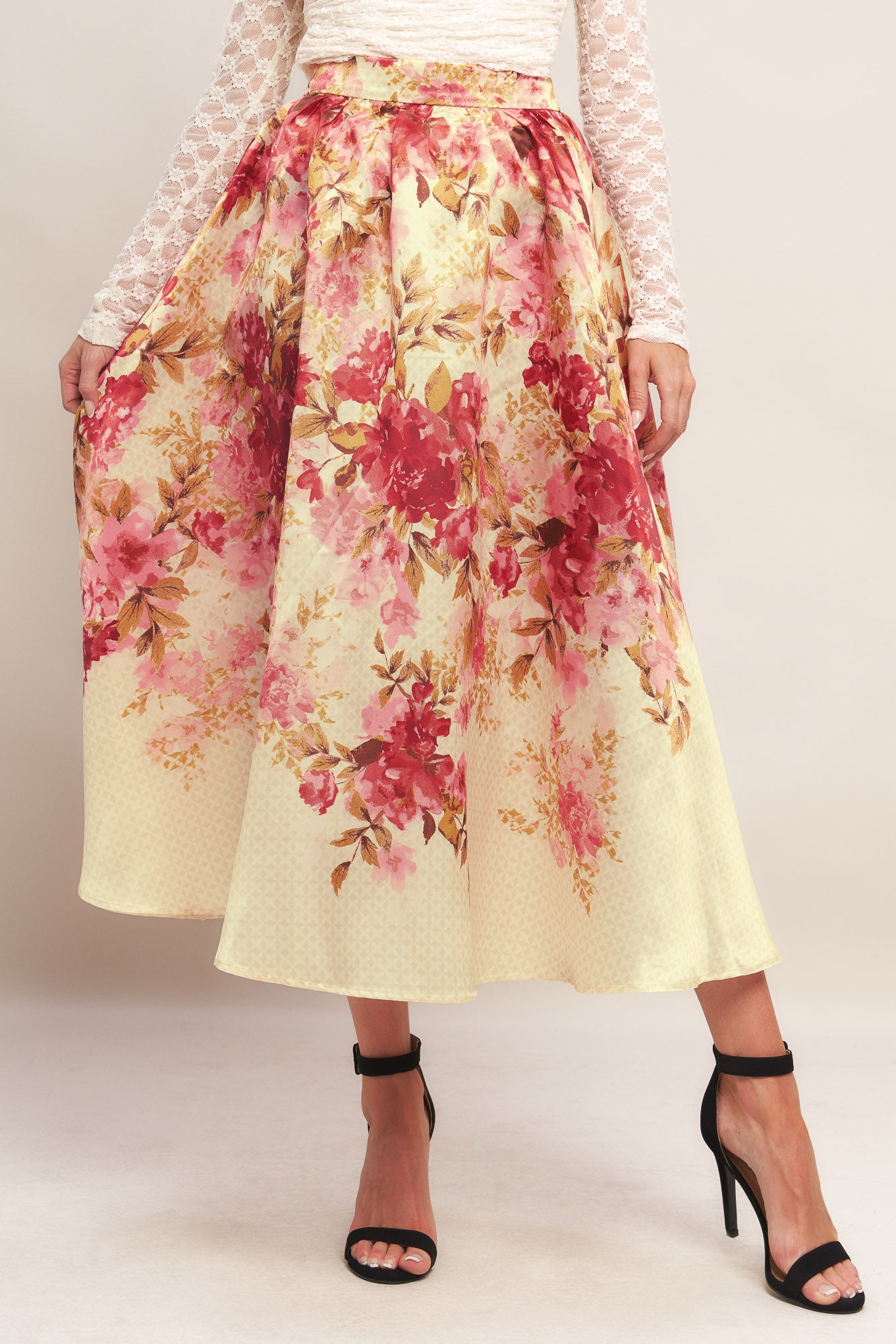 A printed woven full midi skirt with back zipper closure.