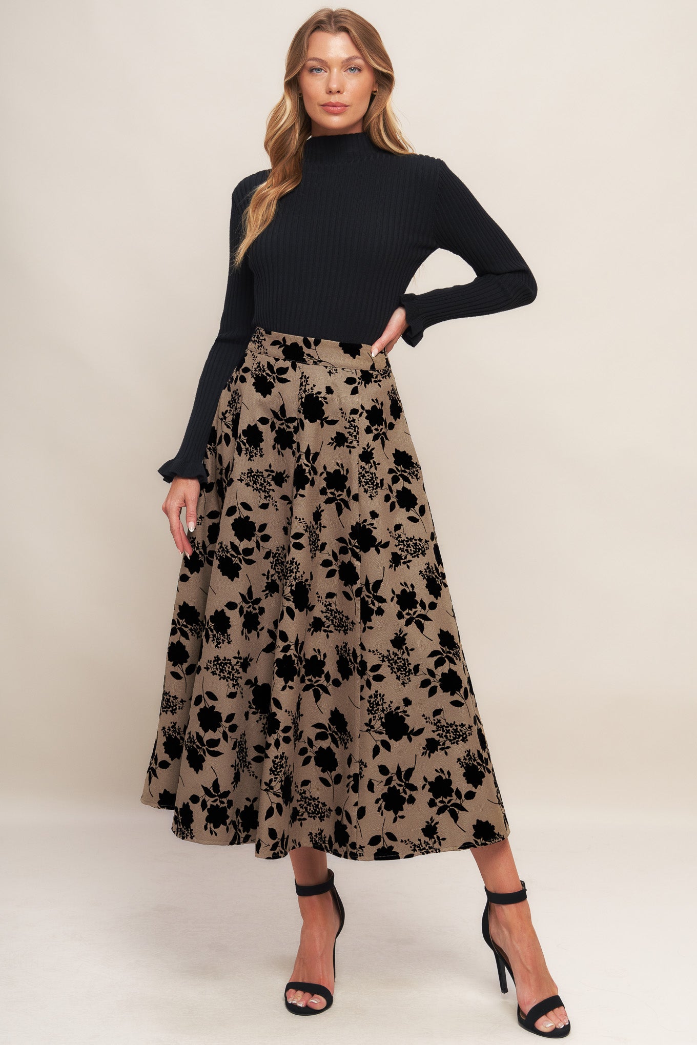 A woven flocking circle skirt with side zipper closure