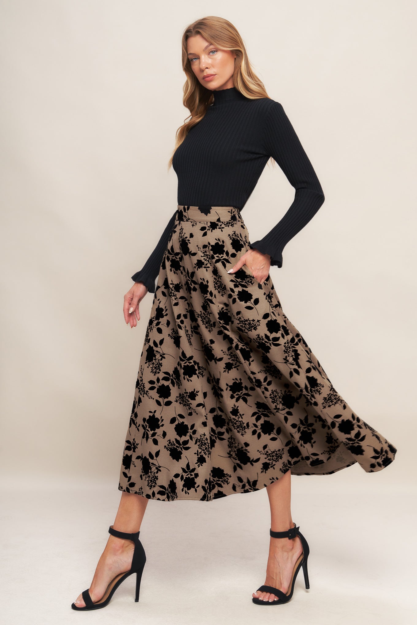 A woven flocking circle skirt with side zipper closure