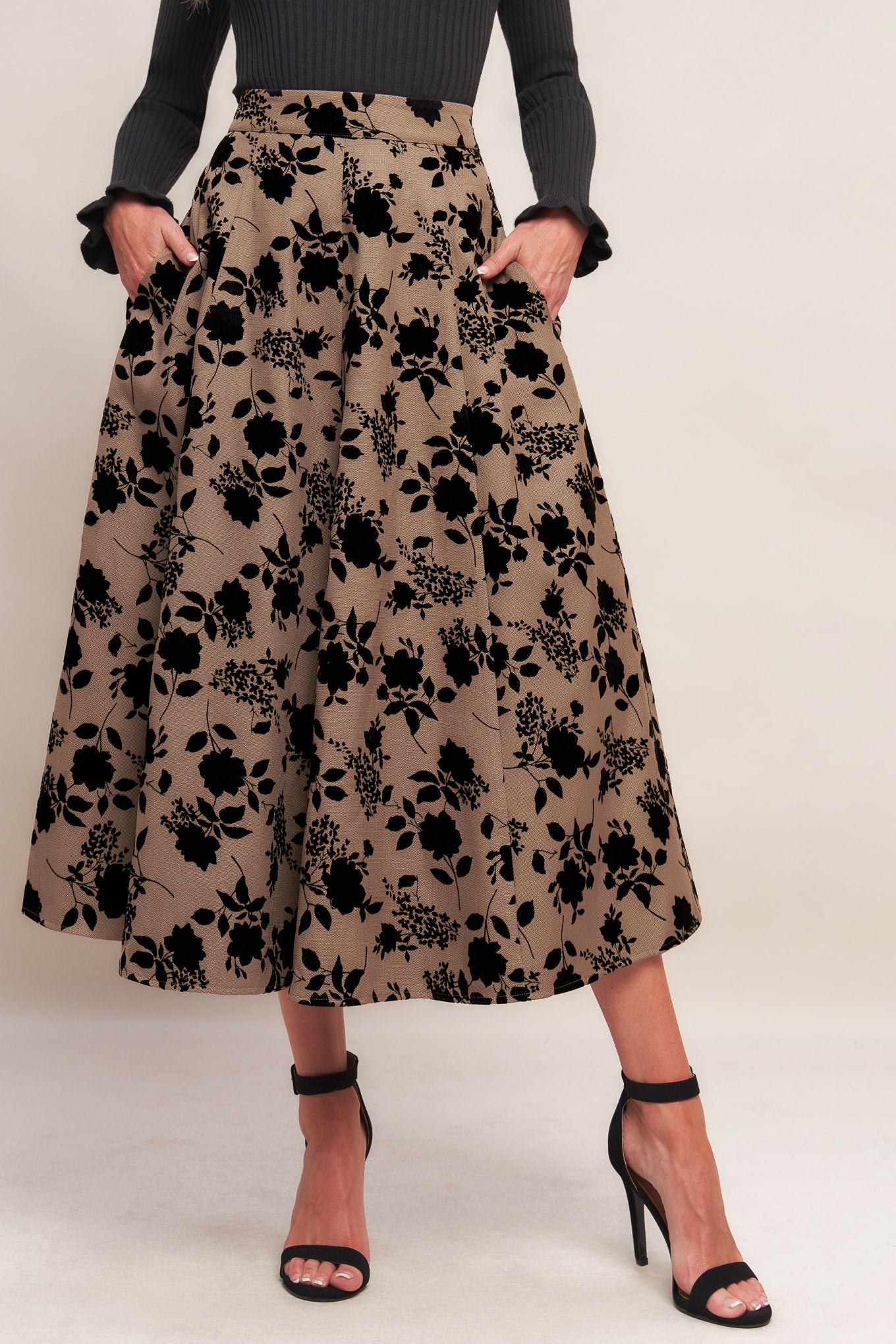 A woven flocking circle skirt with side zipper closure