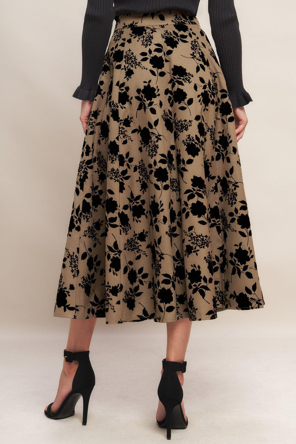 A woven flocking circle skirt with side zipper closure