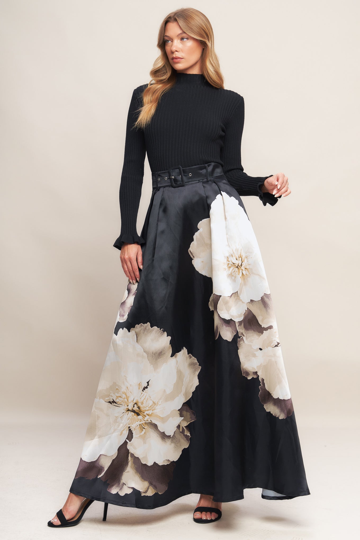 A printed woven maxi skirt with self belt and side zipper closure