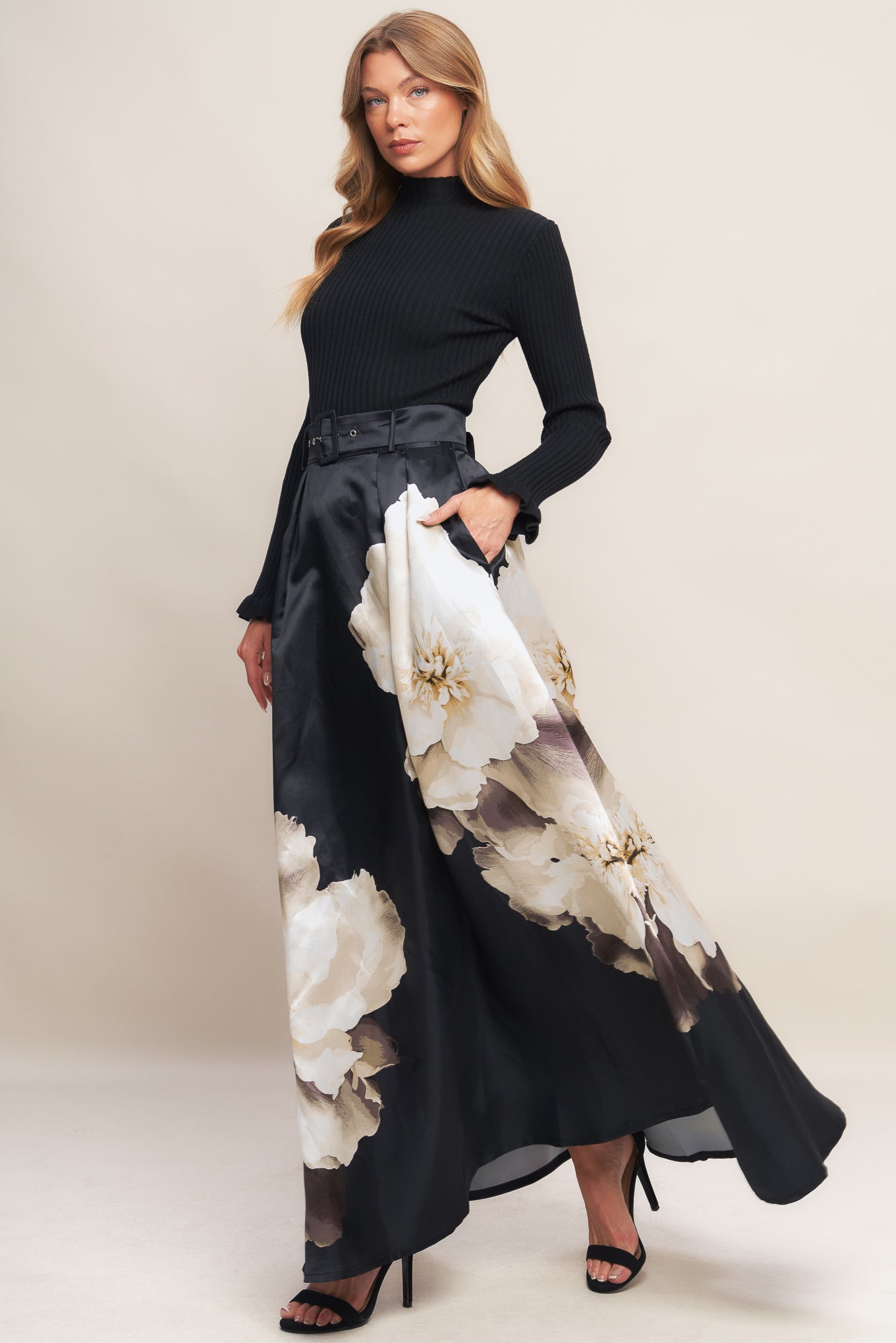 A printed woven maxi skirt with self belt and side zipper closure