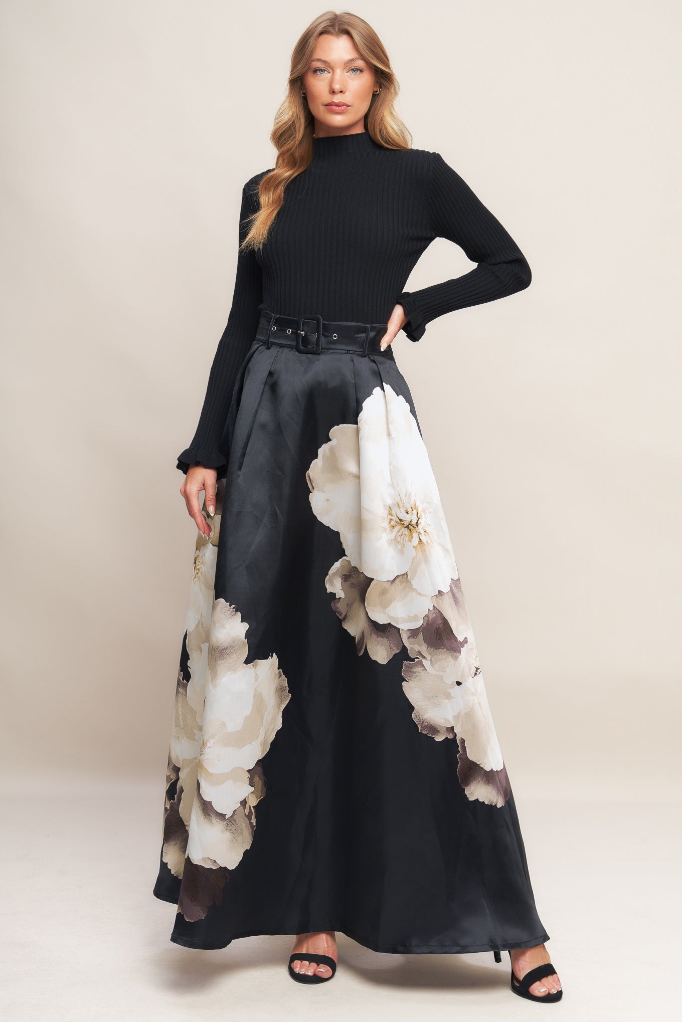 A printed woven maxi skirt with self belt and side zipper closure