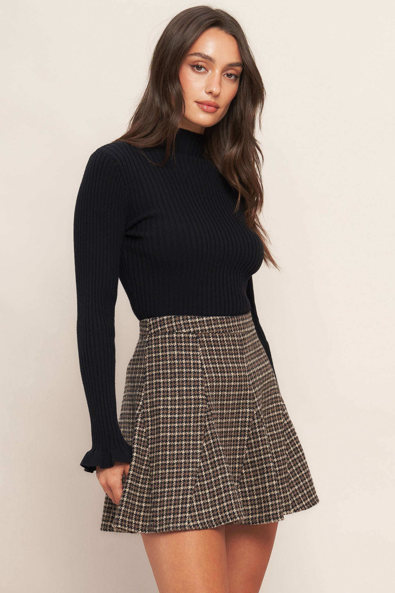 A tweed woven skirt with side zipper closure
