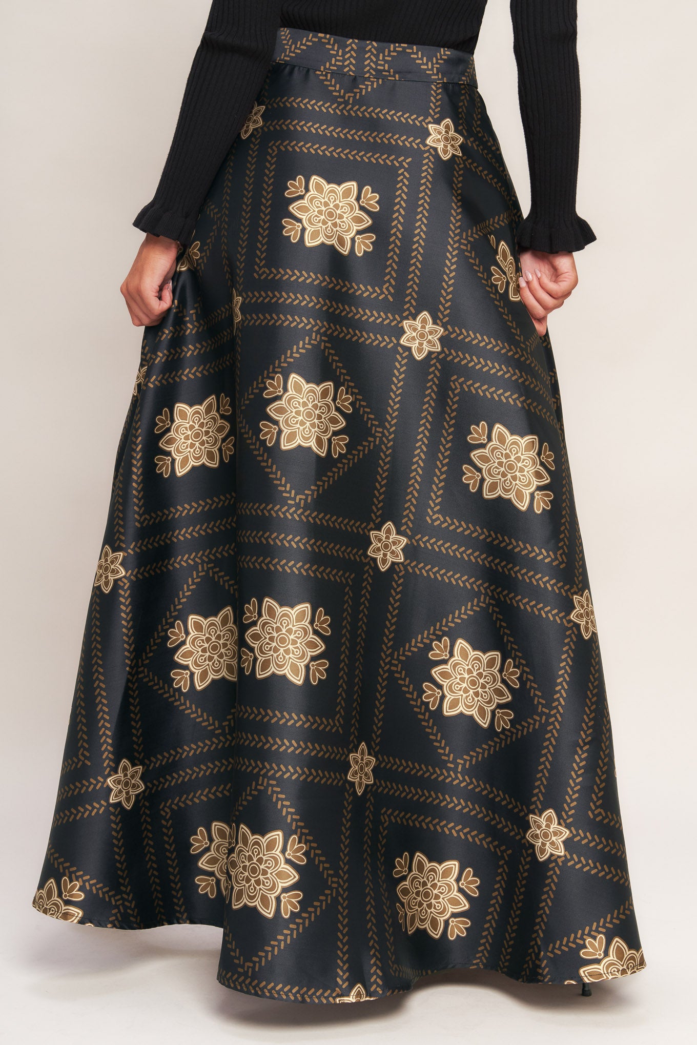 A printed woven maxi circle skirt with side zipper closure