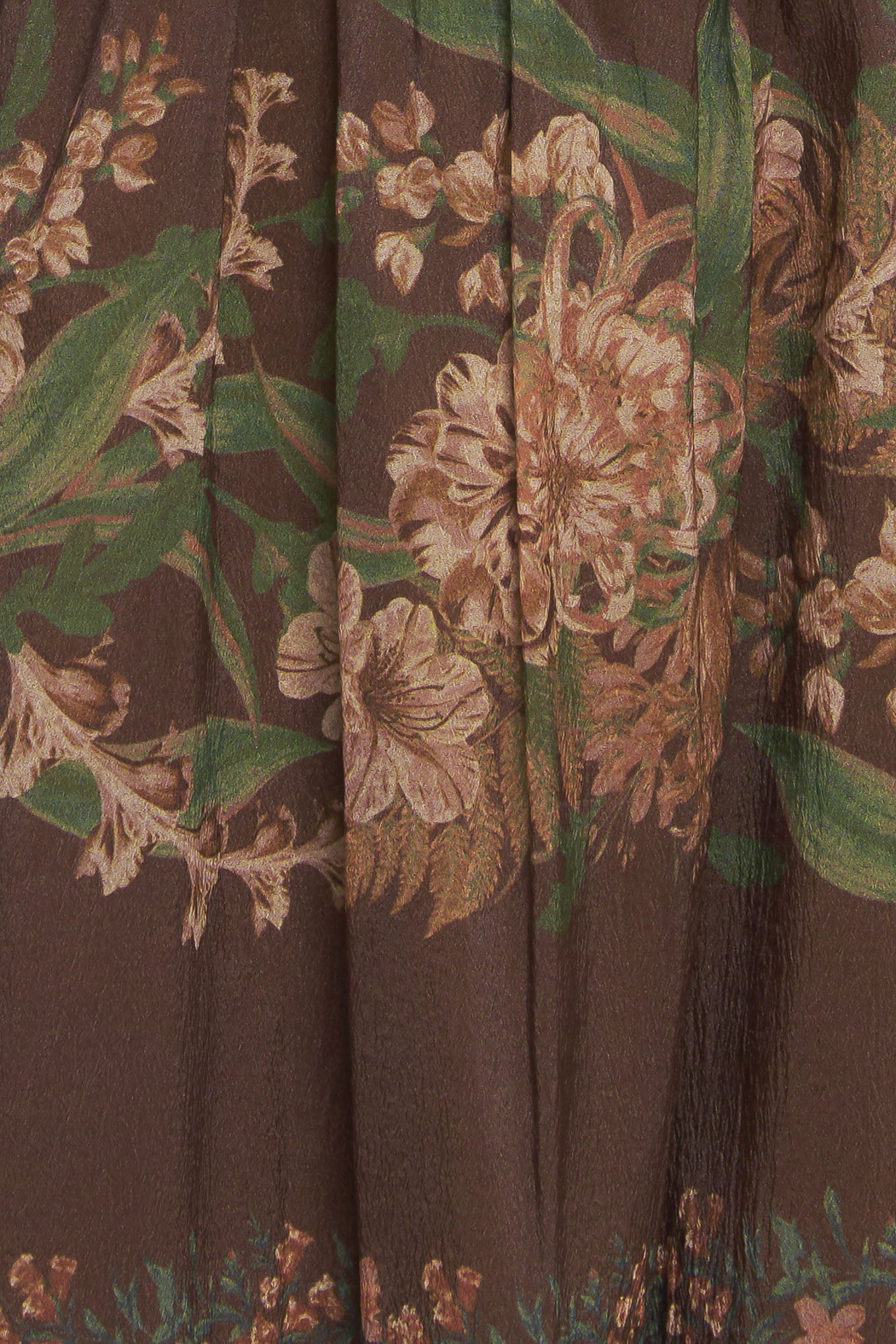 A printed woven maxi skirt featuring elasticized waist and tiers
