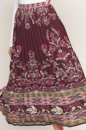 A printed woven pleated midi skirt with side zipper closure. Matching top IT13890