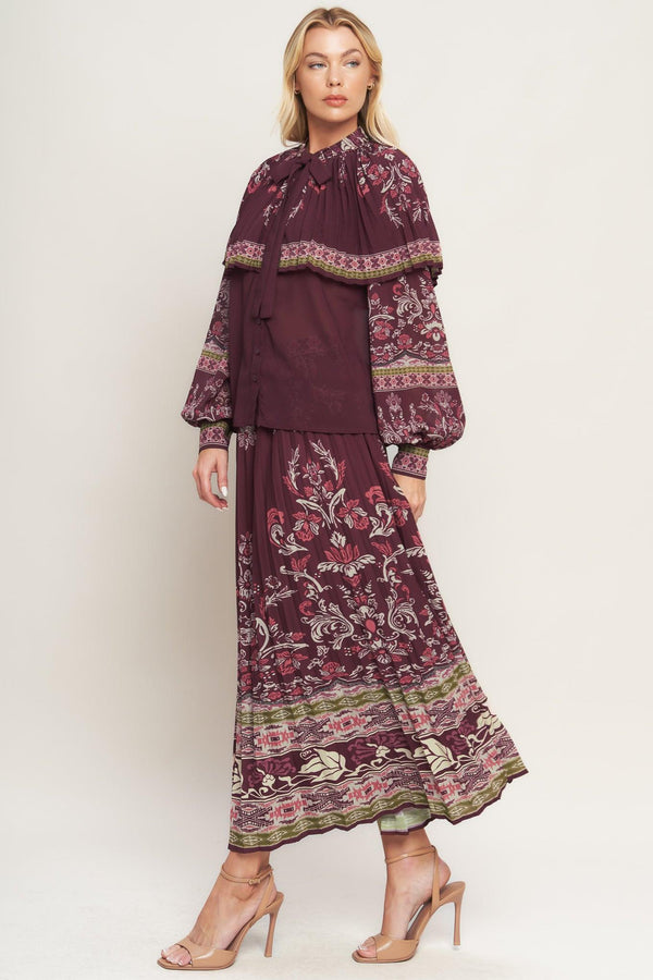 A printed woven pleated midi skirt with side zipper closure. Matching top IT13890