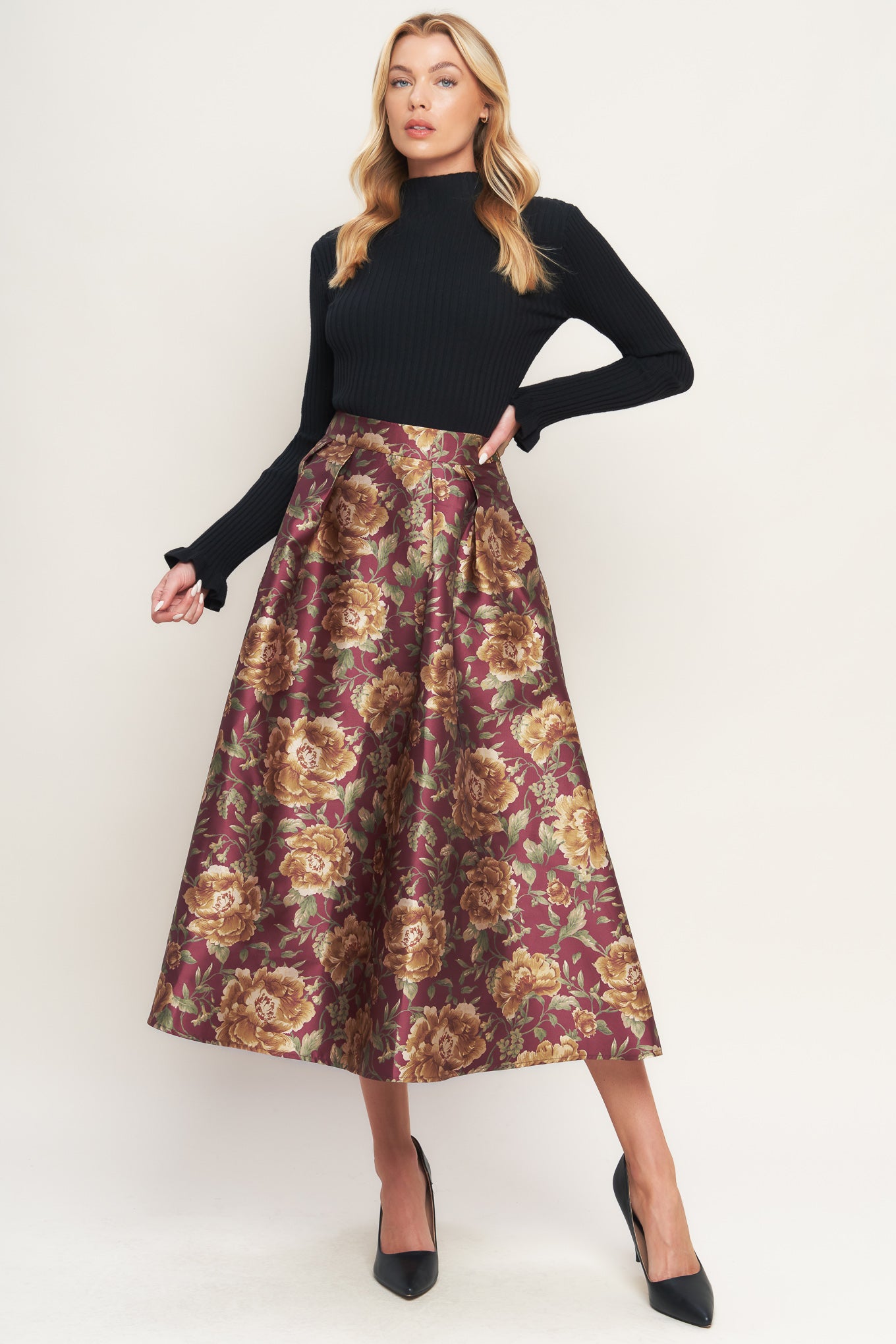 A brown floral printed woven full midi skirt with side zipper closure