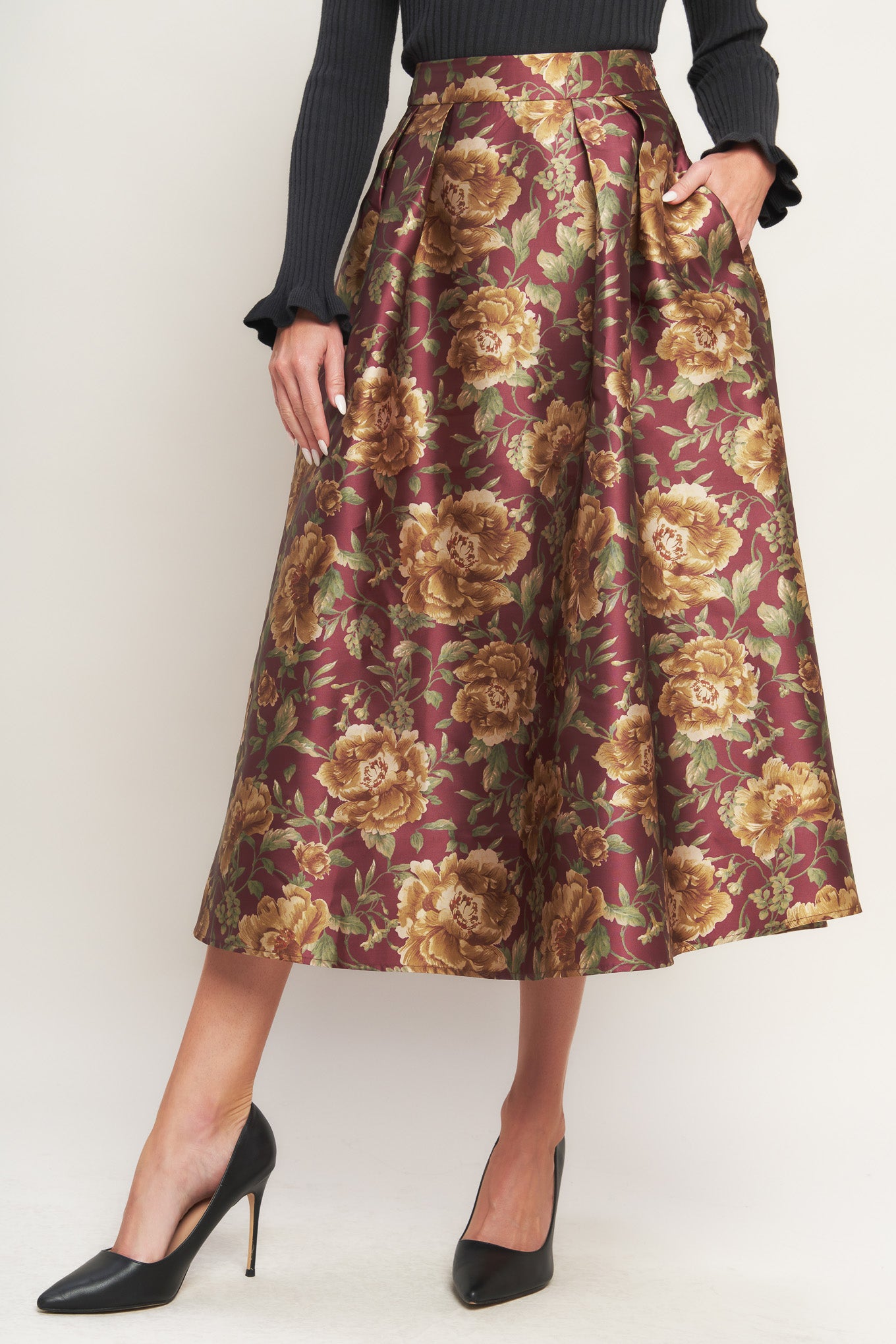 A brown floral printed woven full midi skirt with side zipper closure