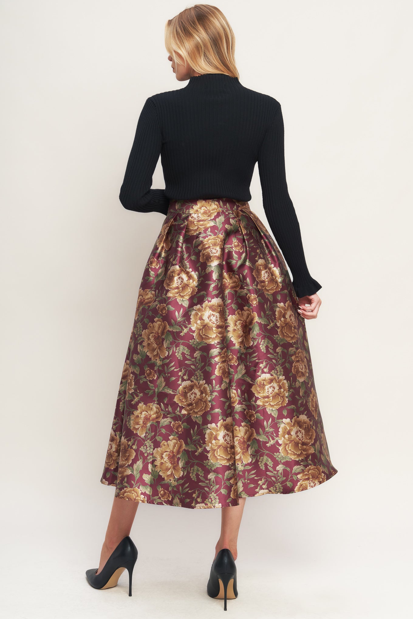 A brown floral printed woven full midi skirt with side zipper closure