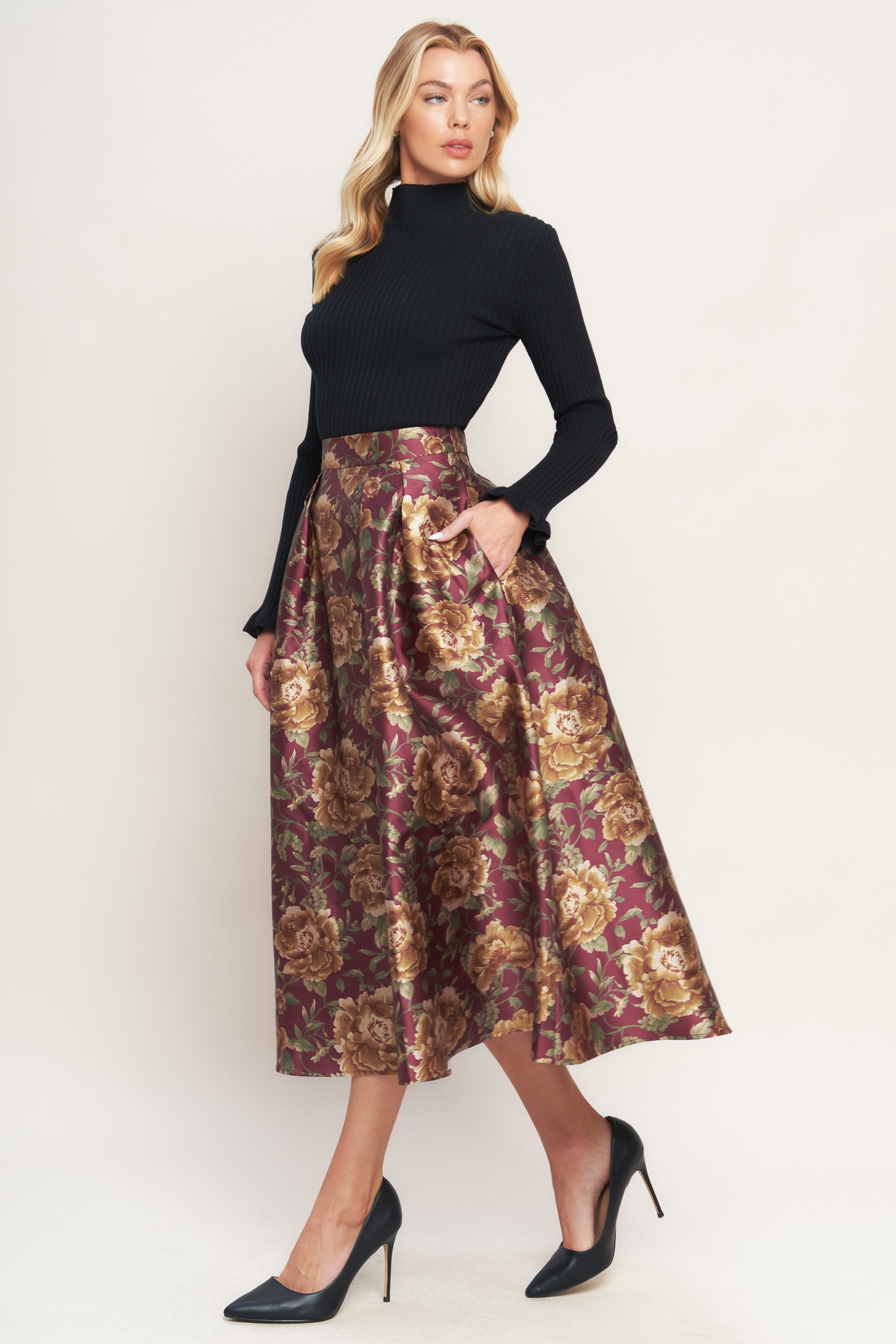 A brown floral printed woven full midi skirt with side zipper closure