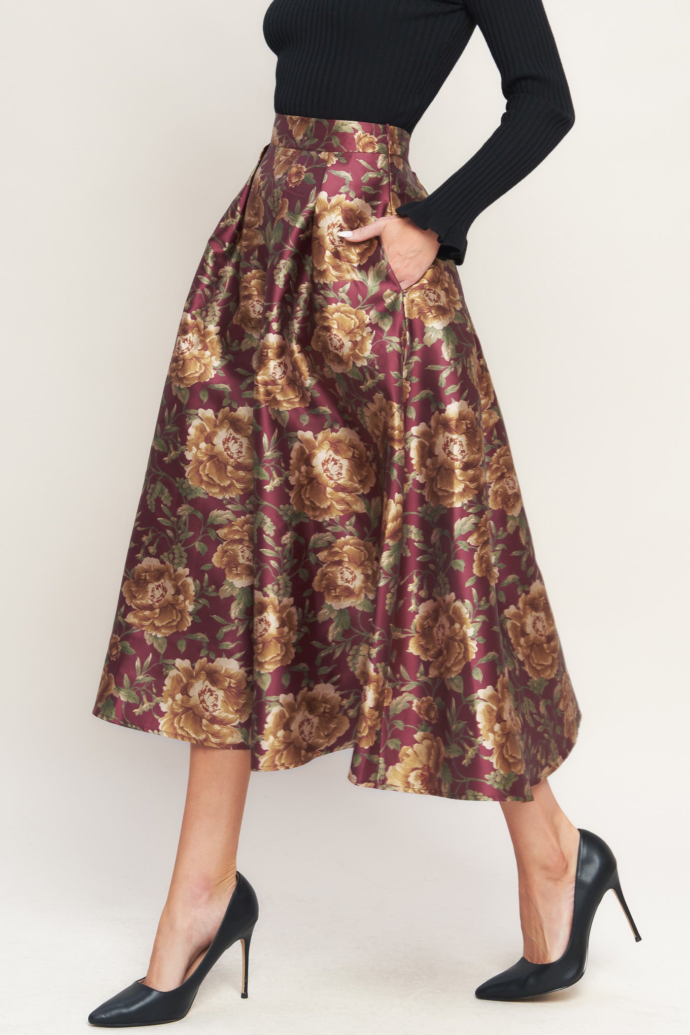 A brown floral printed woven full midi skirt with side zipper closure