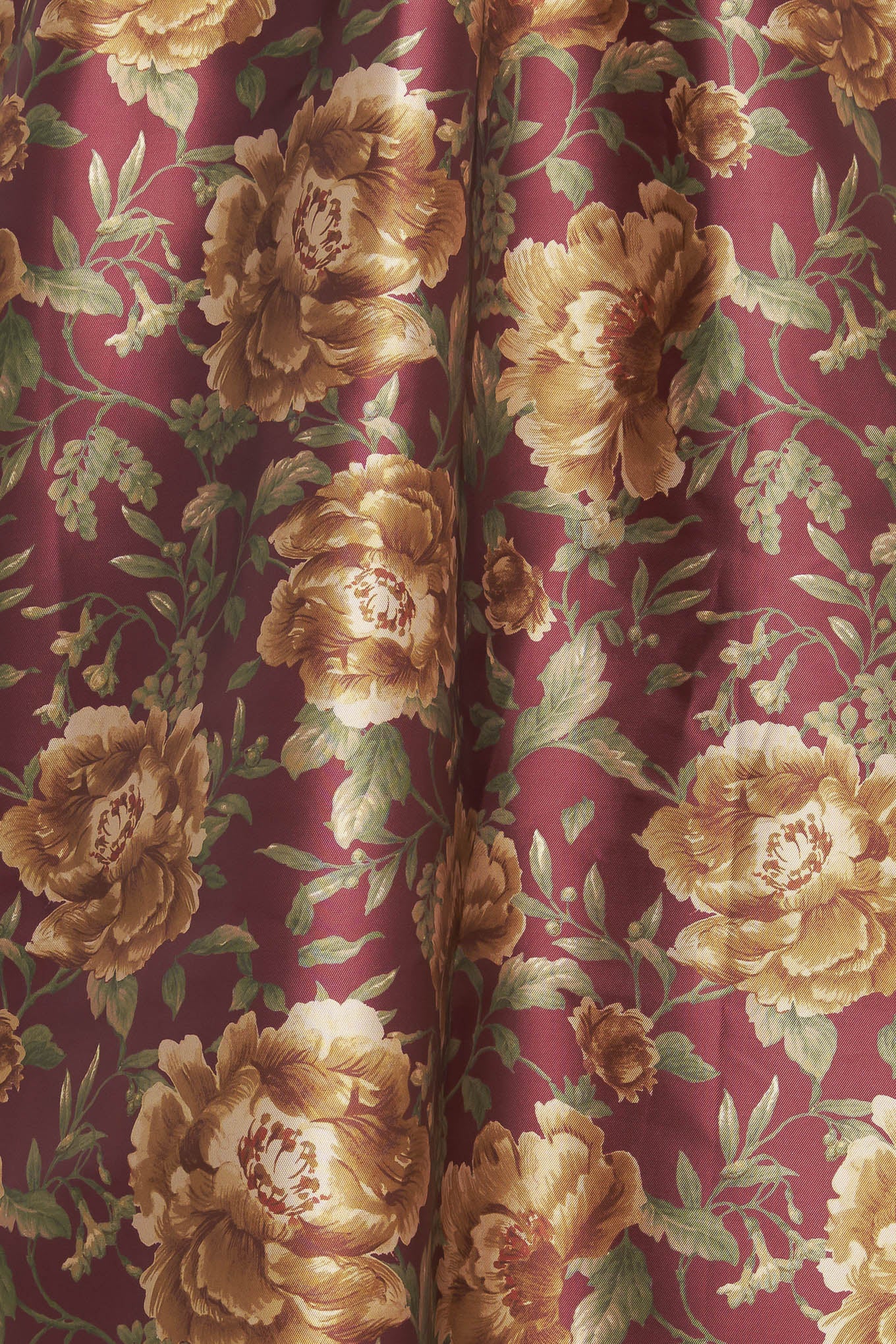 A brown floral printed woven full midi skirt with side zipper closure