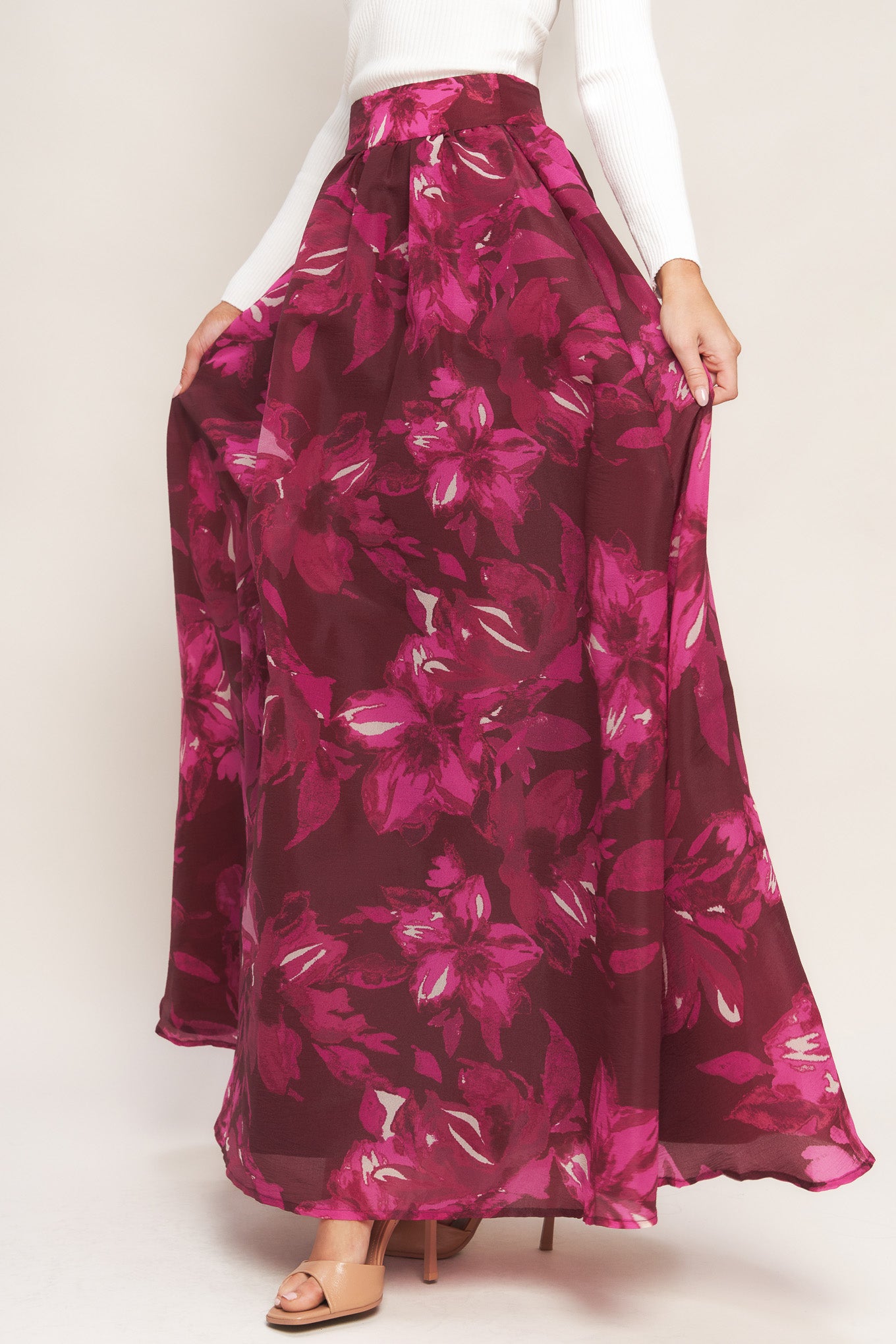 A printed woven maxi full skirt with back zipper closure