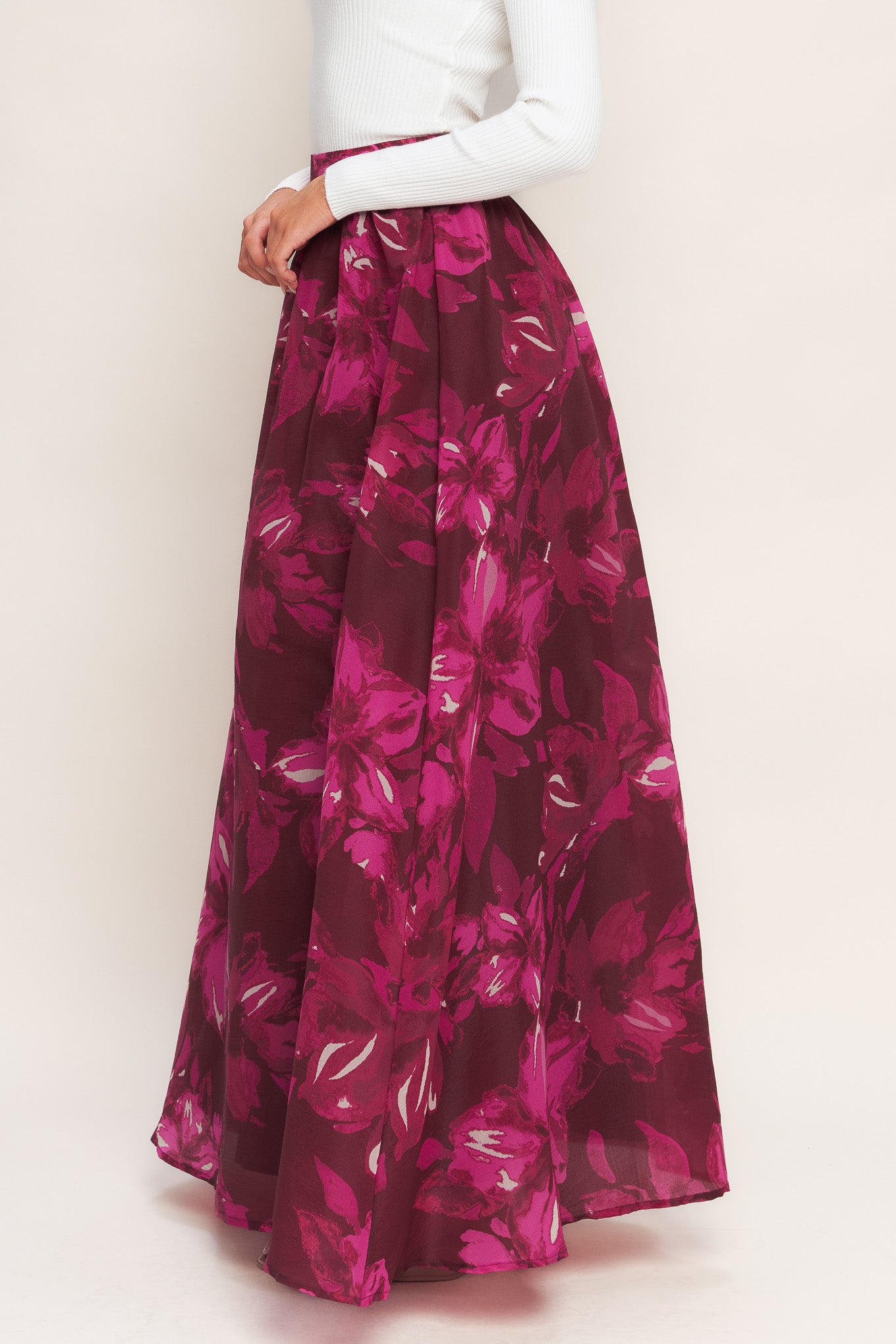 A printed woven maxi full skirt with back zipper closure