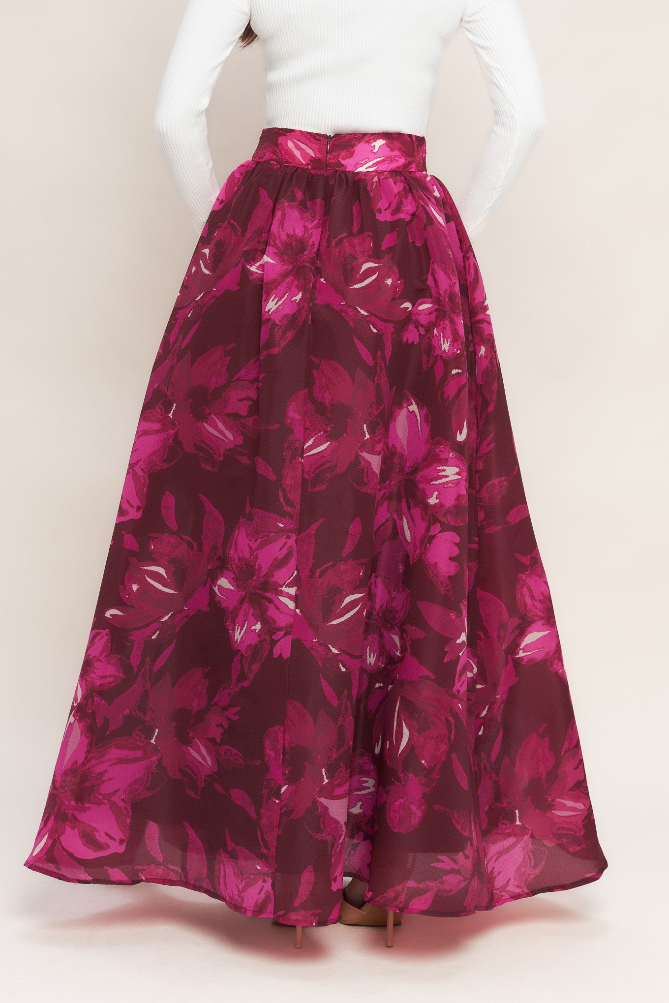 A printed woven maxi full skirt with back zipper closure