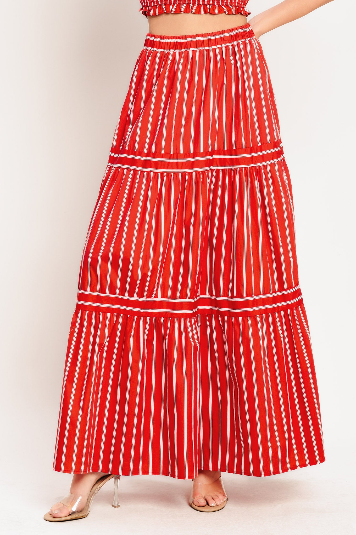 A striped woven maxi skirt with elastic waist and tiered skirt. Matching top IT13960B

Details:

Self: 100% Cotton

Lining: 100% Polyester

Size & Fit

-Model is 5`8" And Wearing Size Small
-Measurements Taken From Size Small
-Approx. Length: 42"