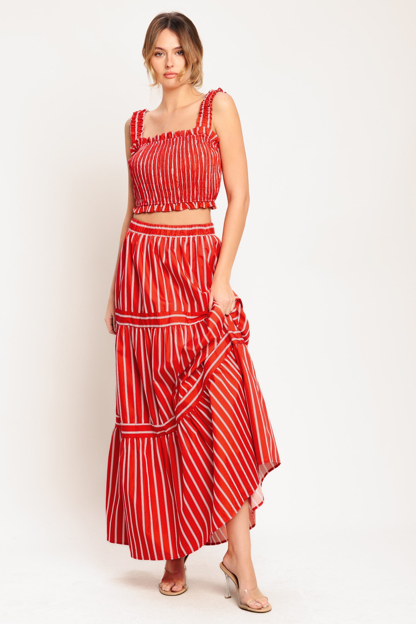A striped woven maxi skirt with elastic waist and tiered skirt. Matching top IT13960B

Details:

Self: 100% Cotton

Lining: 100% Polyester

Size & Fit

-Model is 5`8" And Wearing Size Small
-Measurements Taken From Size Small
-Approx. Length: 42"