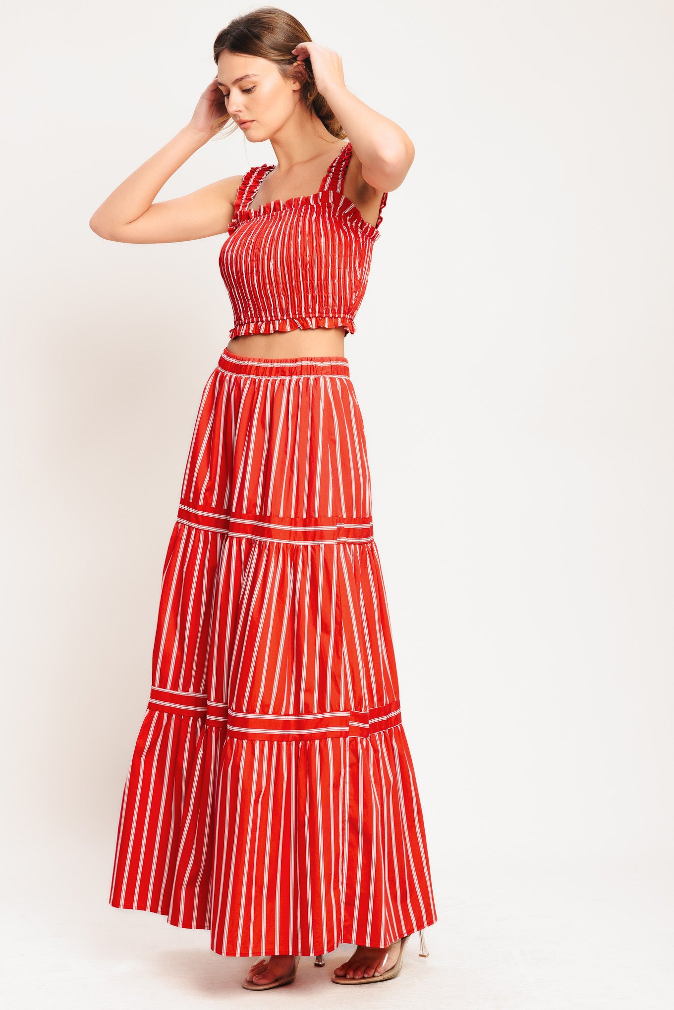 A striped woven maxi skirt with elastic waist and tiered skirt. Matching top IT13960B

Details:

Self: 100% Cotton

Lining: 100% Polyester

Size & Fit

-Model is 5`8" And Wearing Size Small
-Measurements Taken From Size Small
-Approx. Length: 42"