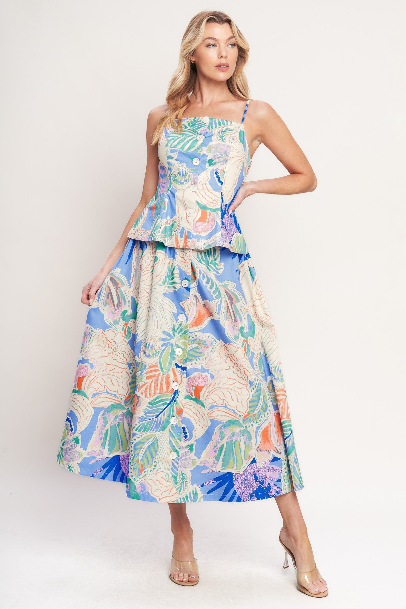 A printed woven full skirt with front button closure

Details:

Self : 100% Cotton

Size & Fit

-Model is 5`8" And Wearing Size Small
-Measurements Taken From Size Small
-Approx. Length: 36"