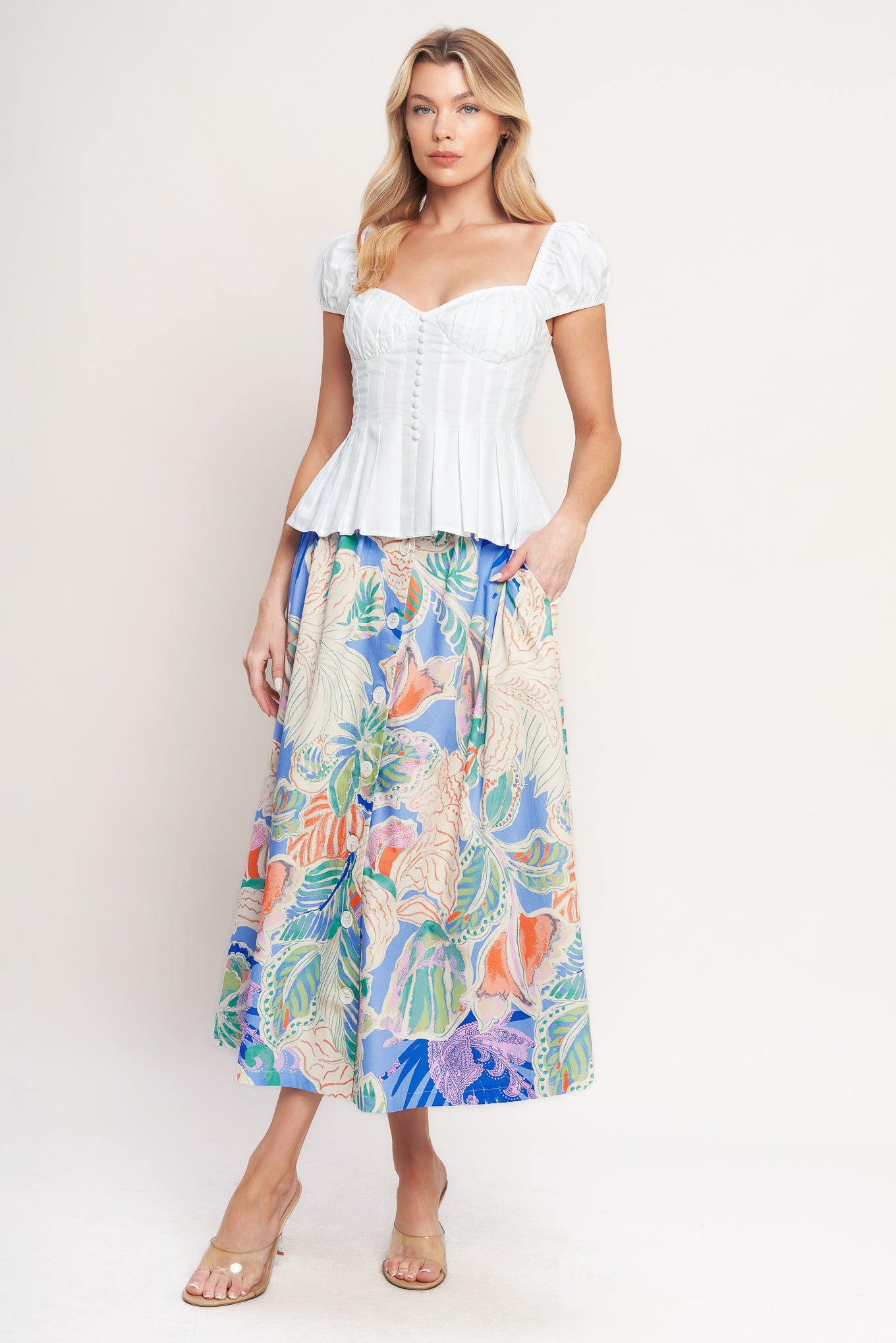A printed woven full skirt with front button closure

Details:

Self : 100% Cotton

Size & Fit

-Model is 5`8" And Wearing Size Small
-Measurements Taken From Size Small
-Approx. Length: 36"