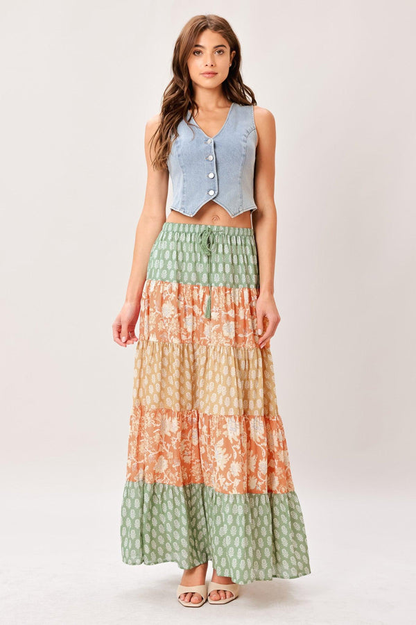 A mix print midi prairie skirt with elastic waist and tie/tassel