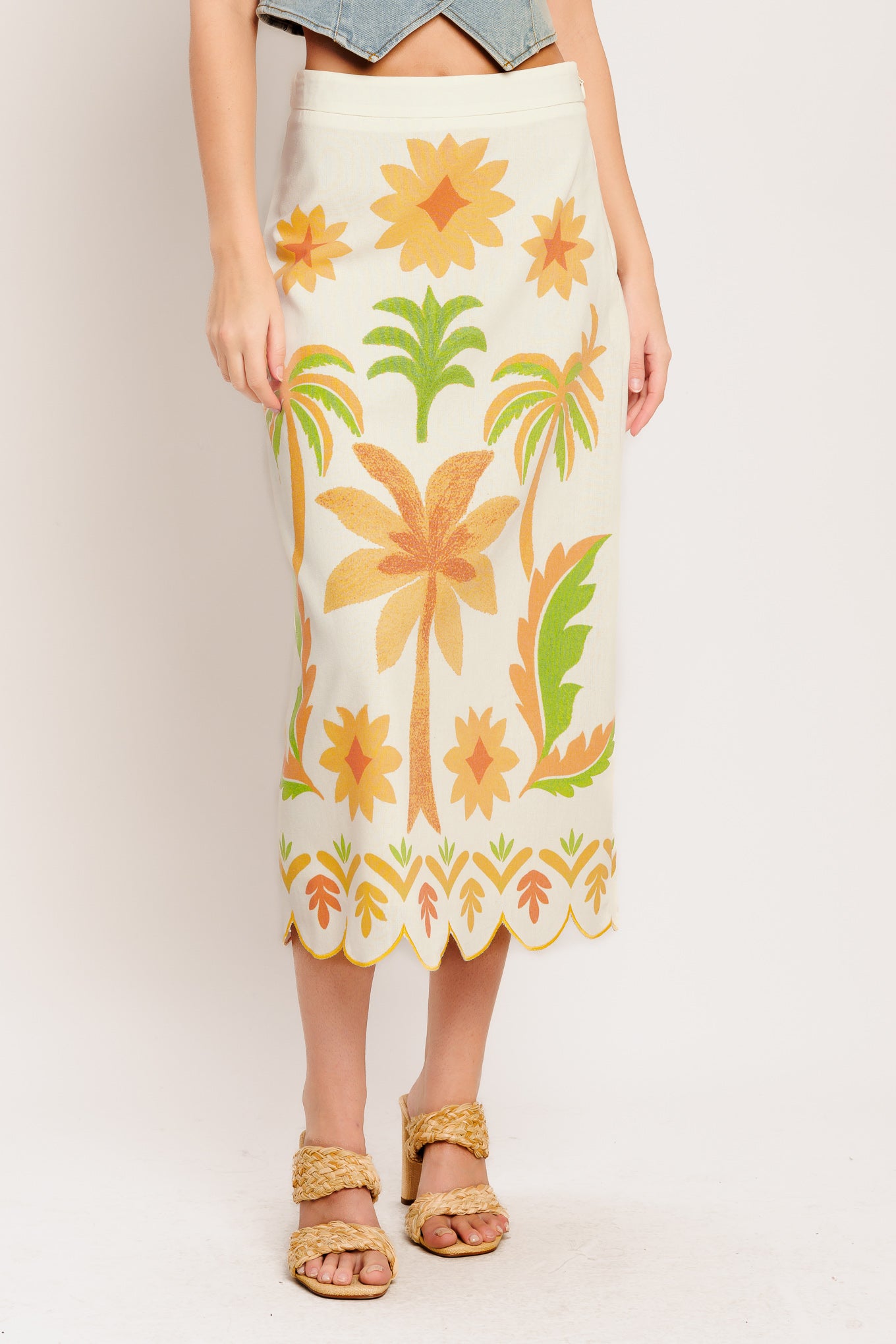A printed woven straight midi skirt featuring scalloped hemline and side zipper closure. Matching top IT14008B

Details:

Self: 50% Cotton 20% Rayon 20% Polyester 10% Linen

Lining : 100% Polyester

Size & Fit

-Model is 5`8" And Wearing Size Small
-Measurements Taken From Size Small
-Approx. Length: 34"