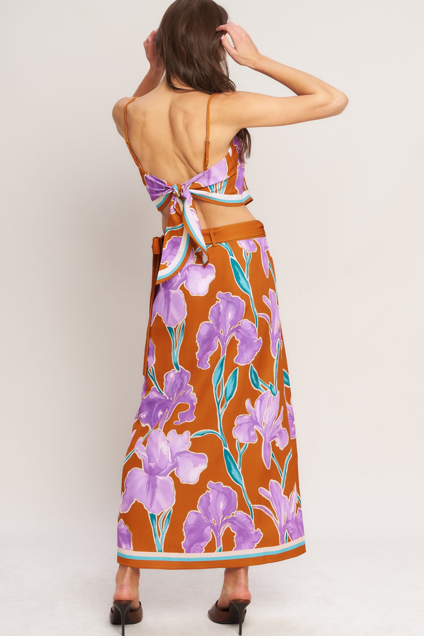 A printed woven midi wrap skirt with side tie.