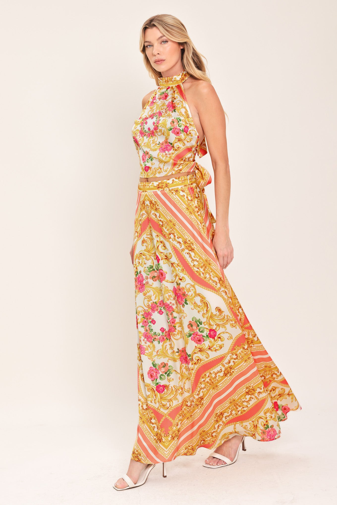 Woman wearing a floral and paisley patterned top and skirt set | Flying Tomato 