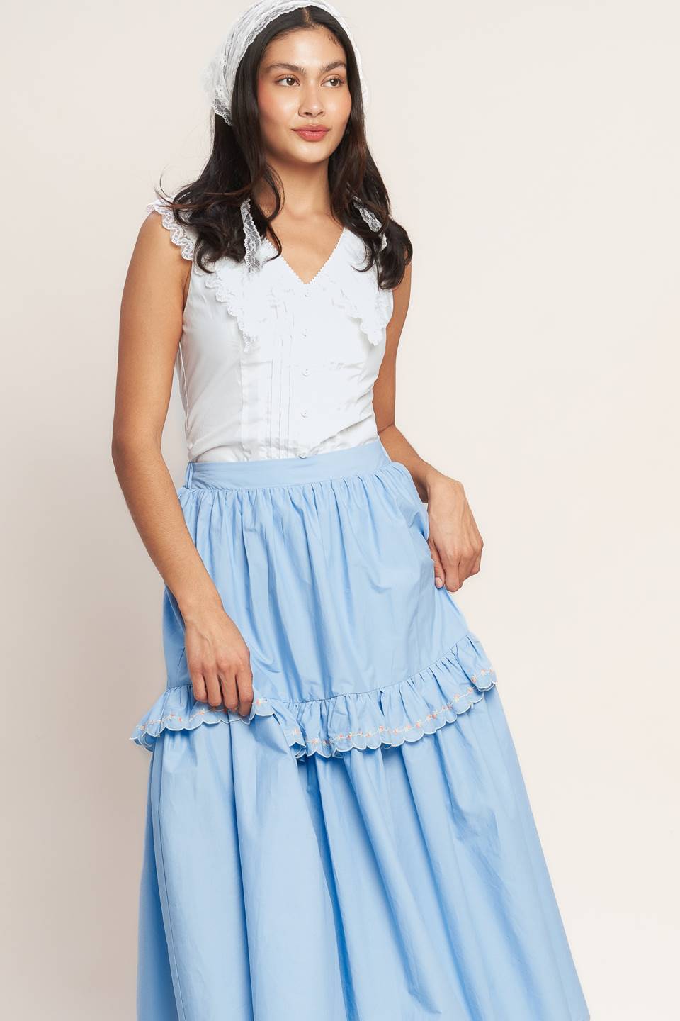 
A solid woven midi skirt featuring one tier skirt with embroidered ruffle and elasticized back waistband. Matching top IT14036B

Details:

Self : 100% Cotton
Lining : 100% Polyester

Size &amp; Fit

- Model is 5`8" And Wearing Size Small
- Measurements Taken From Size Small
- Approx. Length: 35" - Flying Tomato