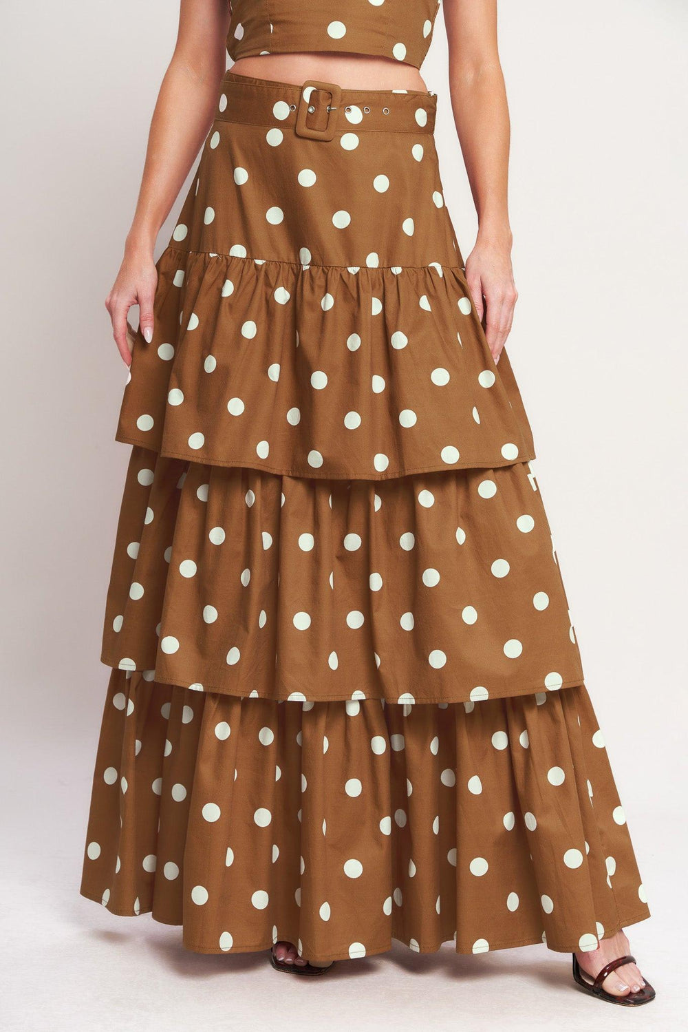 
A printed woven skirt featuring 3 layers, side zipper and self belt. Matching top IT14070B

Details:

Self : 100% Cotton
Lining : 100% Polyester

Size &amp; Fit

- Model is 5`8" And Wearing Size Small
- Measurements Taken From Size Small
- Approx. Length: 44"