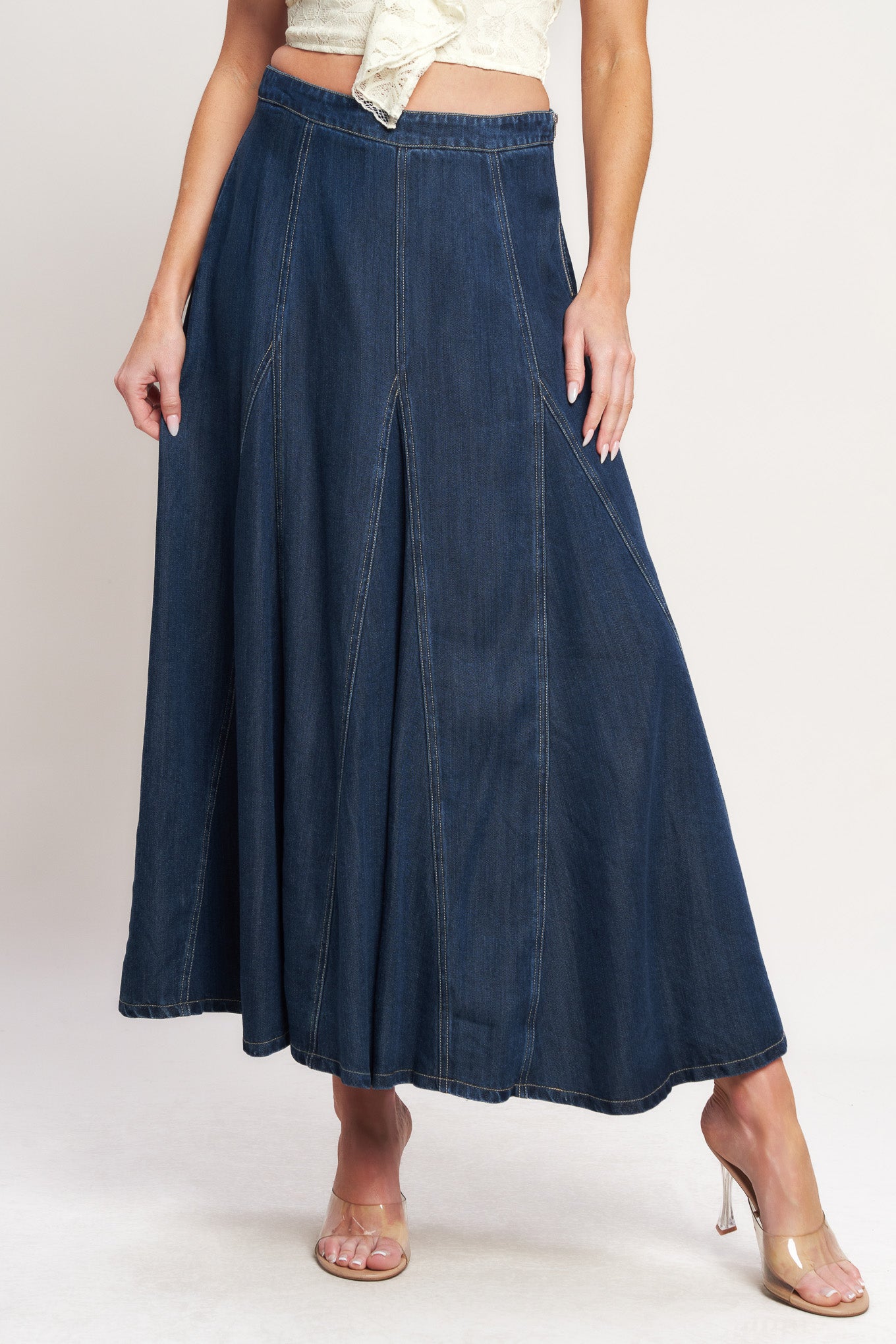 
A woven circle skirt with side zipper closure

Details:

Self : 100% Lyocell

Size &amp; Fit

- Model is 5`8" And Wearing Size Small
- Measurements Taken From Size Small
- Approx. Length: 37"