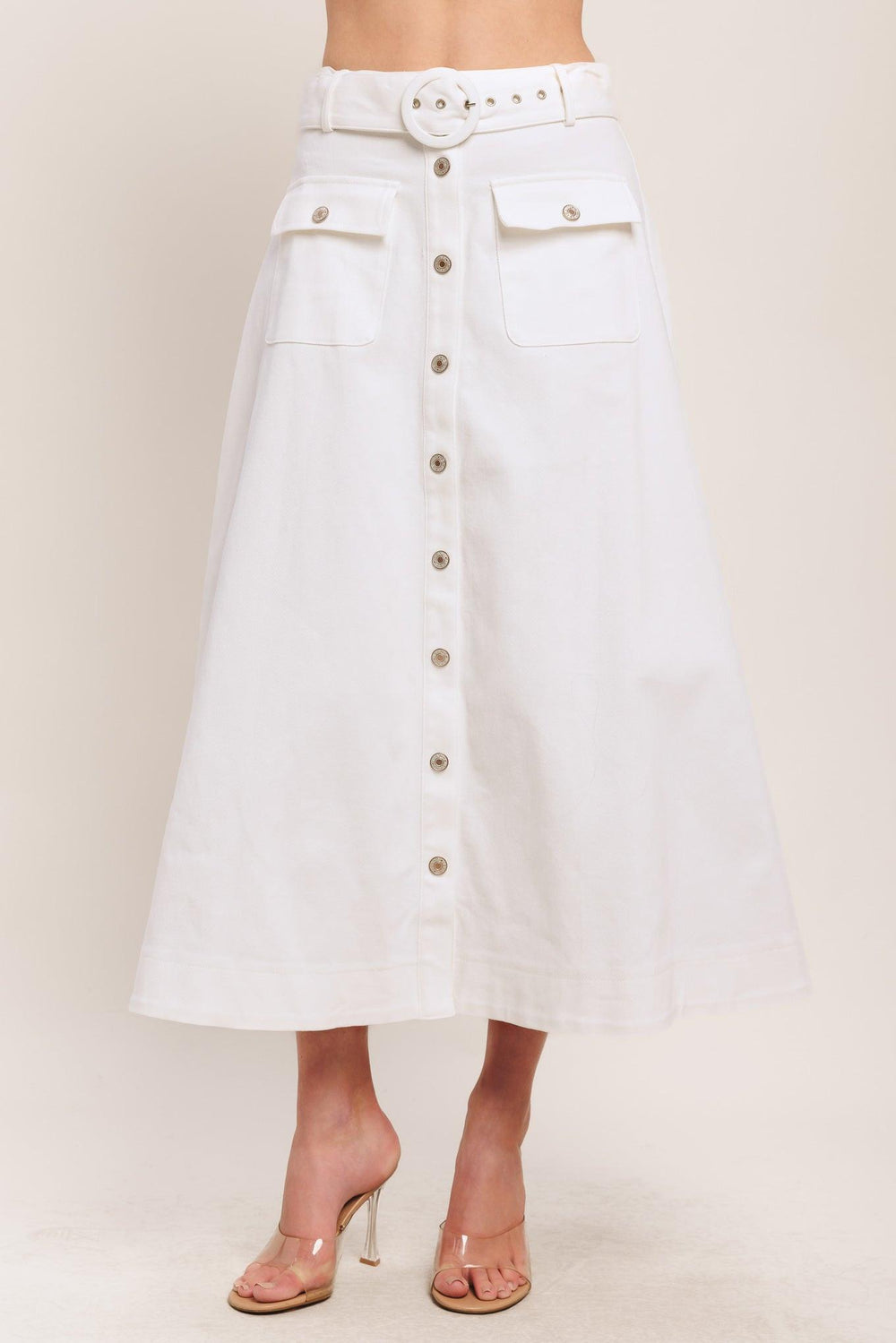A solid woven midi skirt featuring self belt, front button down and pockets. Matching top IT14089B

Details:

Self: 97% Cotton 3% Spandex

Size & Fit

-Model is 5`8" And Wearing Size Small
-Measurements Taken From Size Small
-Approx. Length: 34"