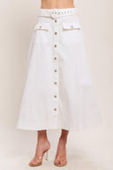 A solid woven midi skirt featuring self belt, front button down and pockets. Matching top IT14089B

Details:

Self: 97% Cotton 3% Spandex

Size & Fit

-Model is 5`8" And Wearing Size Small
-Measurements Taken From Size Small
-Approx. Length: 34"