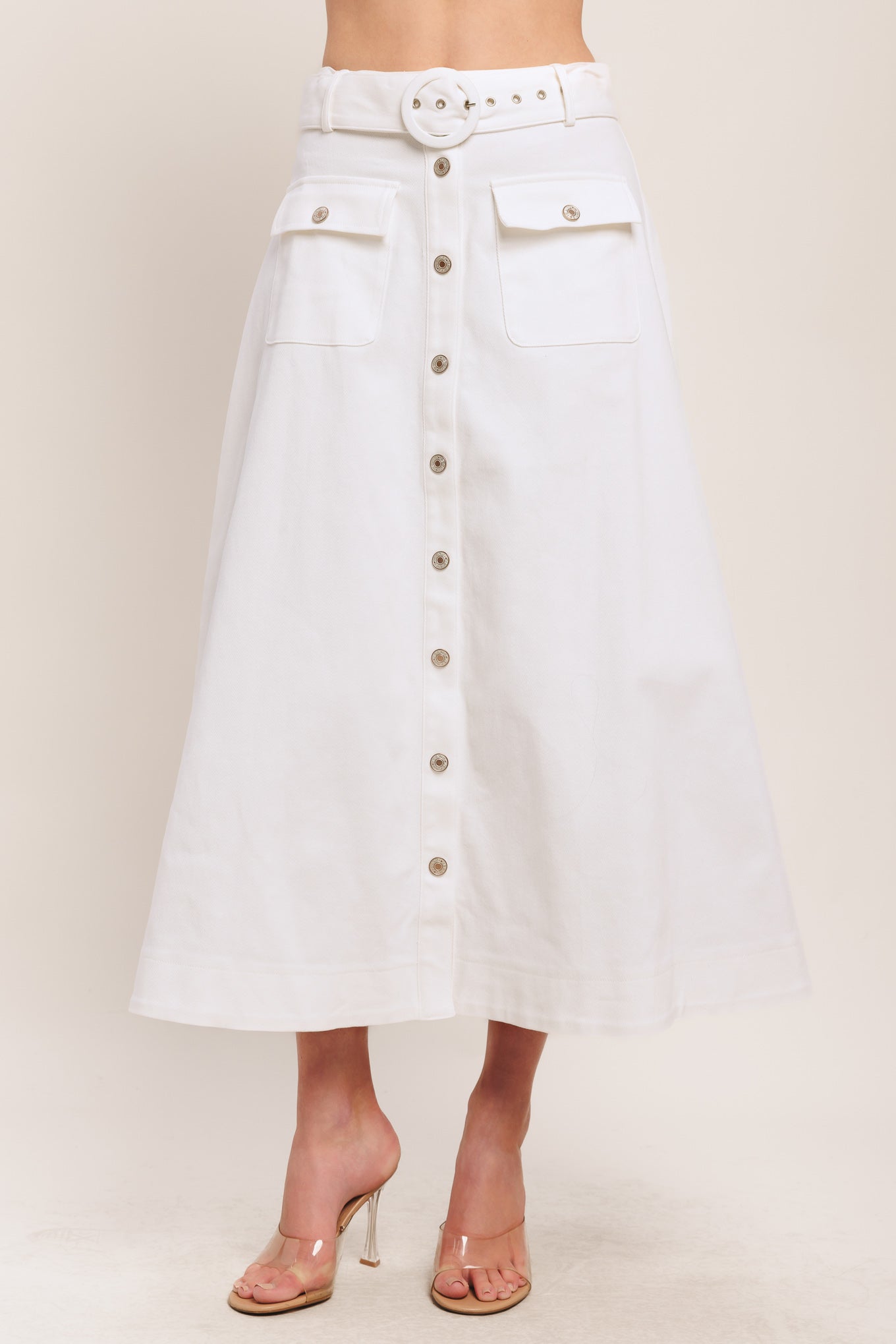 A solid woven midi skirt featuring self belt, front button down and pockets. Matching top IT14089B

Details:

Self: 97% Cotton 3% Spandex

Size & Fit

-Model is 5`8" And Wearing Size Small
-Measurements Taken From Size Small
-Approx. Length: 34"