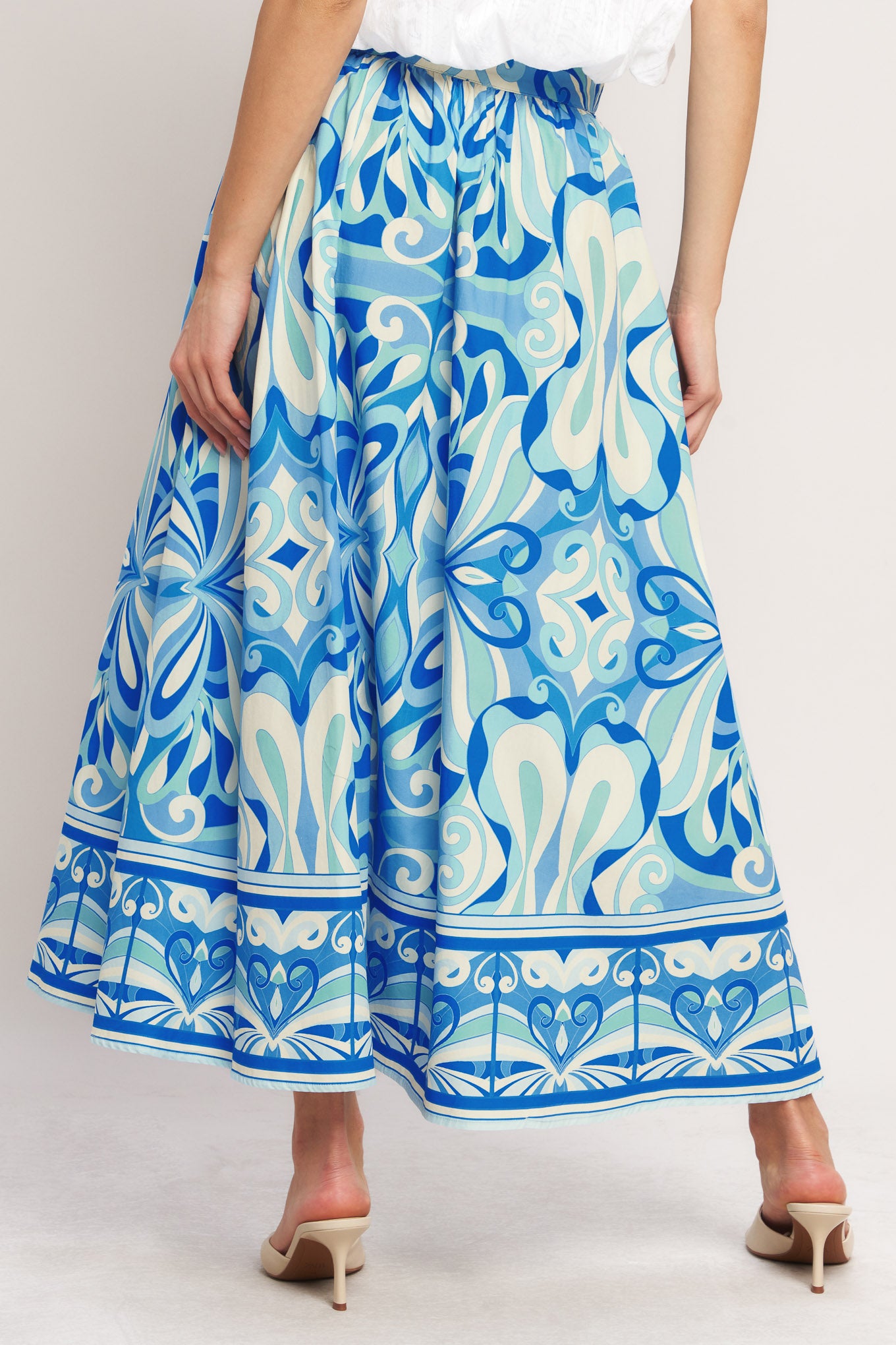 Blue and white patterned skirt on a plain background