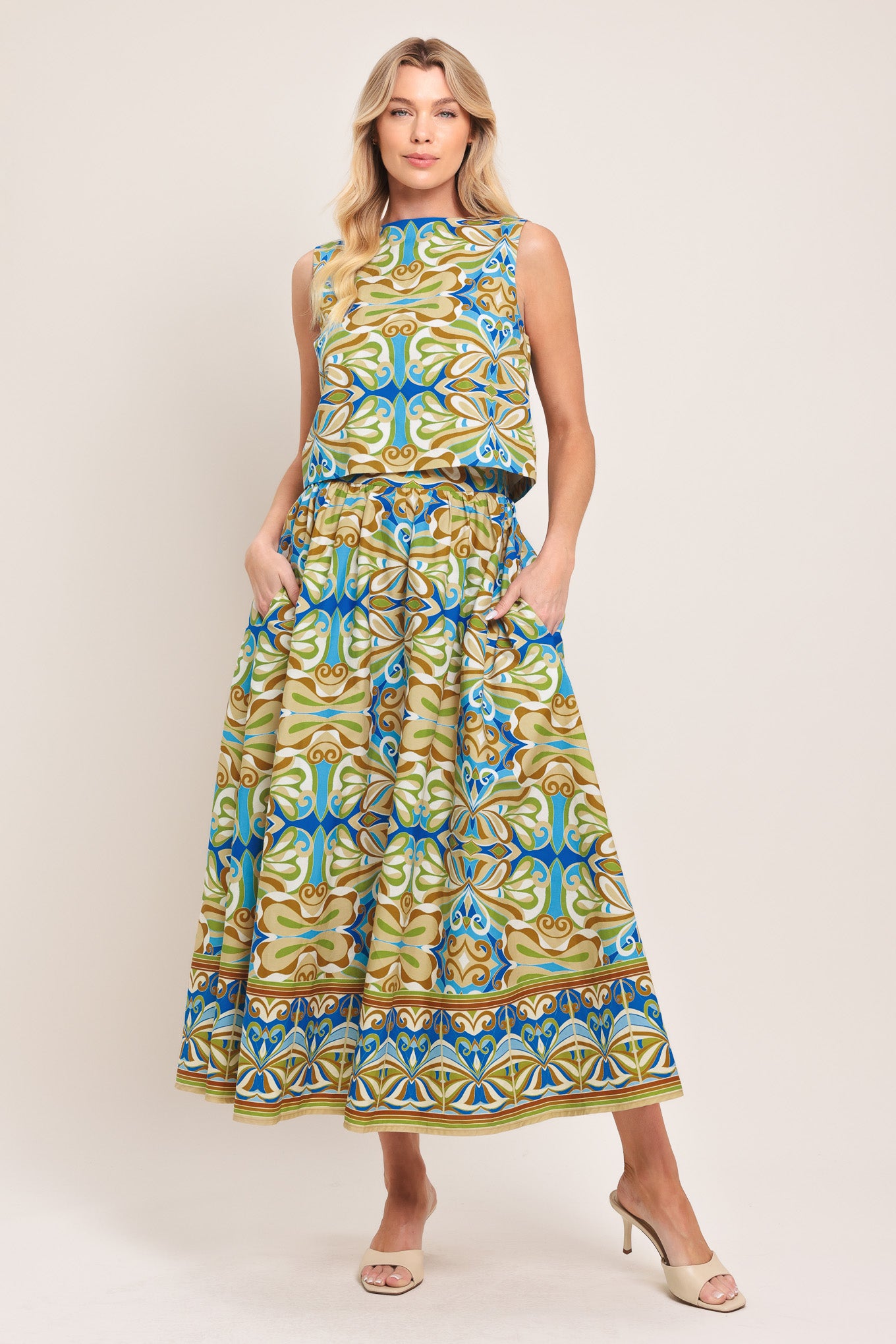 Woman wearing patterned full skirt with blue, green, and beige colors with elastic back waistband | Flying Tomato