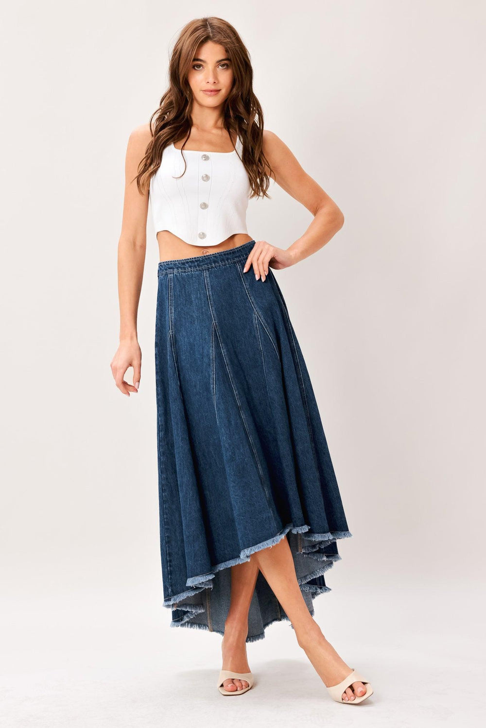 A washed denim hi-lo midi circle skirt with fray hem and back zipper closure