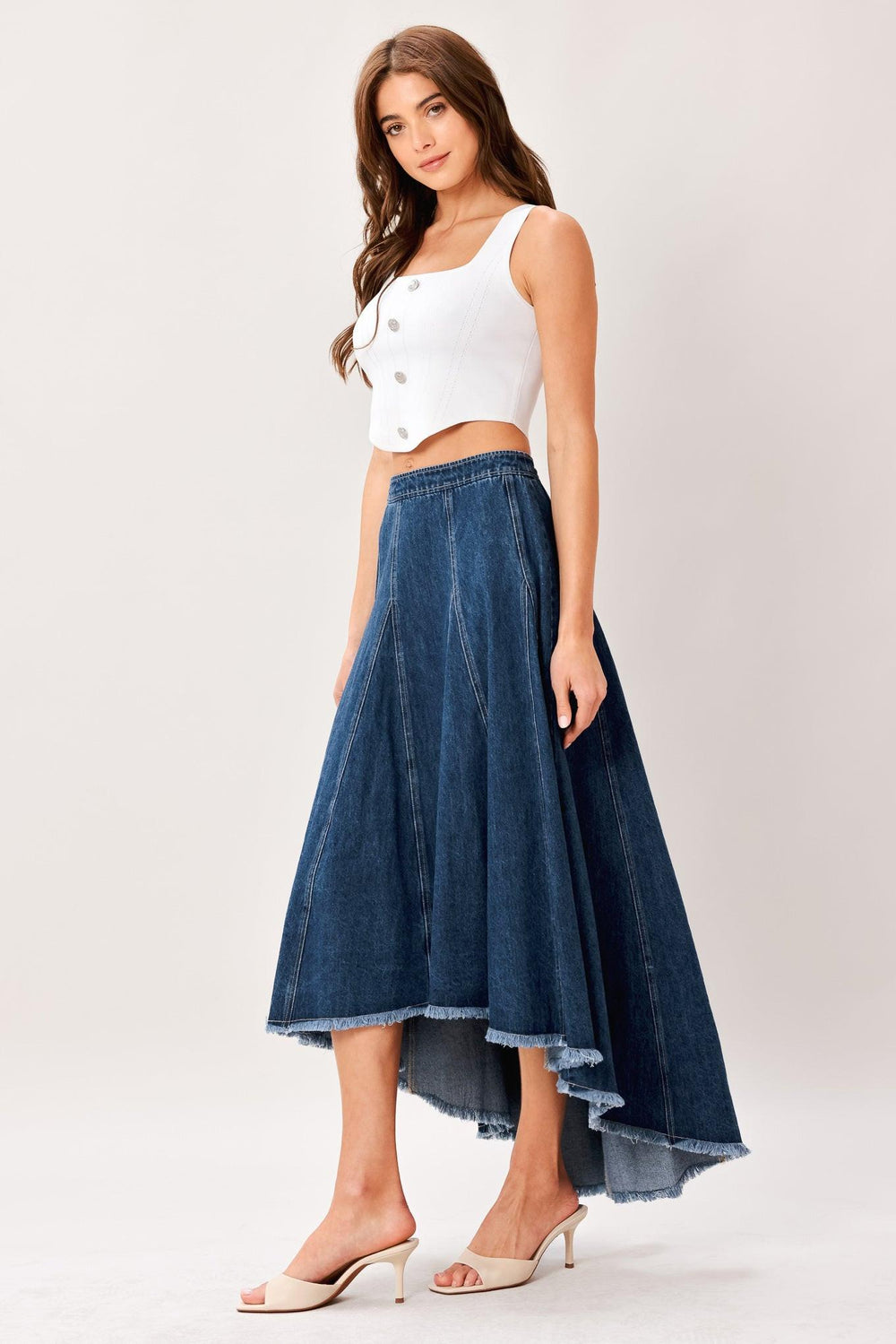 A washed denim hi-lo midi circle skirt with fray hem and back zipper closure