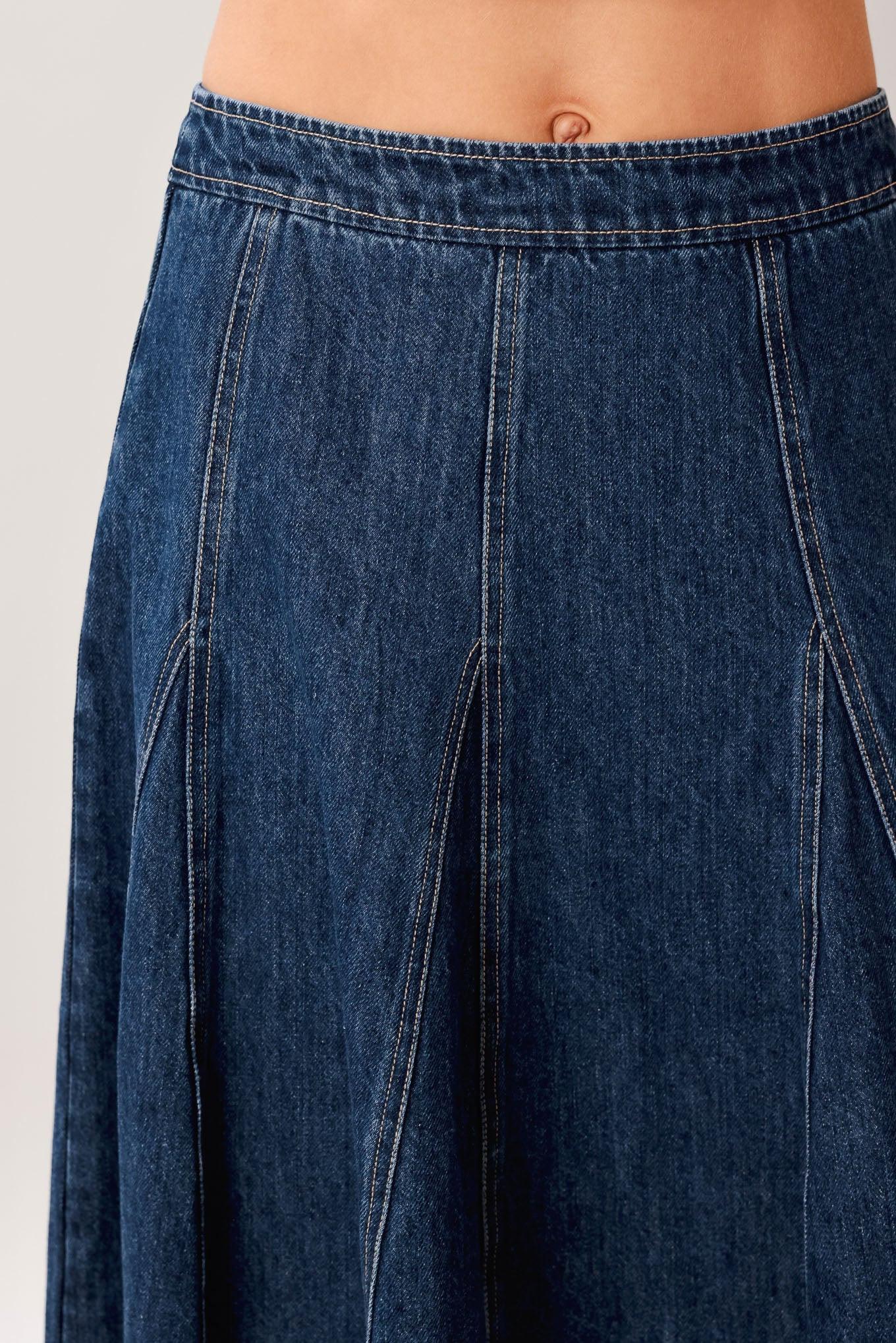 A washed denim hi-lo midi circle skirt with fray hem and back zipper closure
